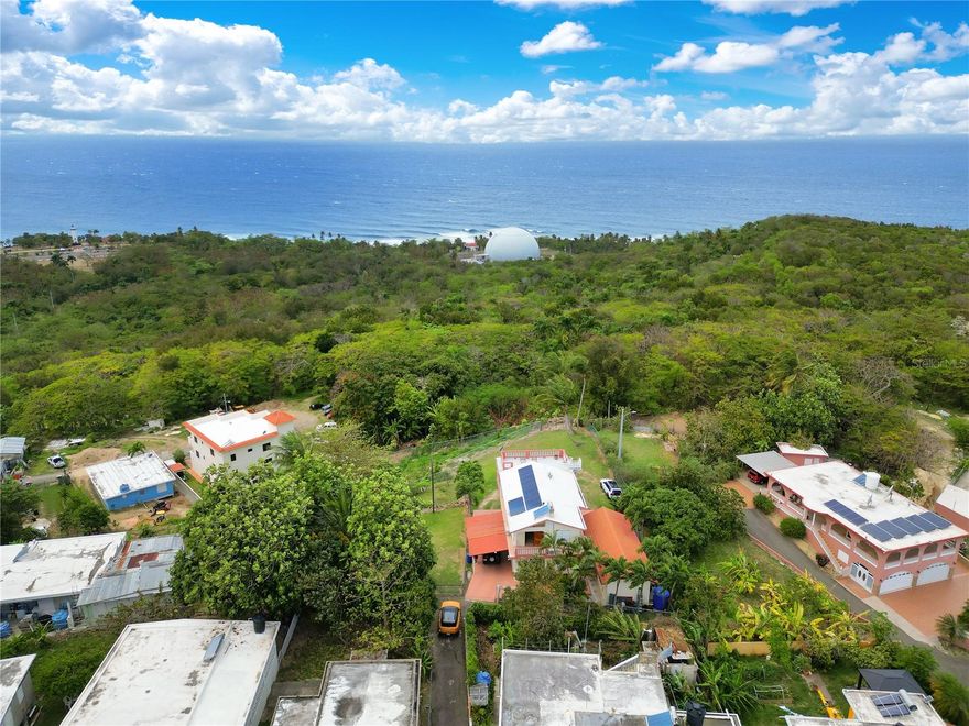 Located in the Puntas area of Rincón, this duplex offers privacy, functionality, and open coastal views in a quiet residential setting. The property consists of two independent units, each with 2 bedrooms and 2 bathrooms, suitable for full-time living or income-producing use.
Both units feature private balconies with unobstructed ocean views, allowing for seasonal whale watching directly from the property. A shared rooftop terrace expands the outdoor living space and captures sweeping coastal and sunset views. An outdoor shower provides added convenience after beach or surf sessions.
The kitchens are designed with French-style windows, promoting a constant ocean breeze, complemented by high ceilings throughout that enhance airflow and natural light. The property includes an electric vehicle gate entrance, adding security and ease of access.
Set on a peaceful side road just off Road 413, the location offers tranquility while remaining close to key surf and beach destinations, including a short drive to Sandy Beach and Domes Beach.
Additional features include a fully fenced yard, carport for multiple vehicles, dedicated storage for surfboards or outdoor gear, and backup water and power systems for added reliability.
A well-rounded property in one of Rincón’s most desirable neighborhoods—schedule your private showing to experience the views, breeze, and setting firsthand.