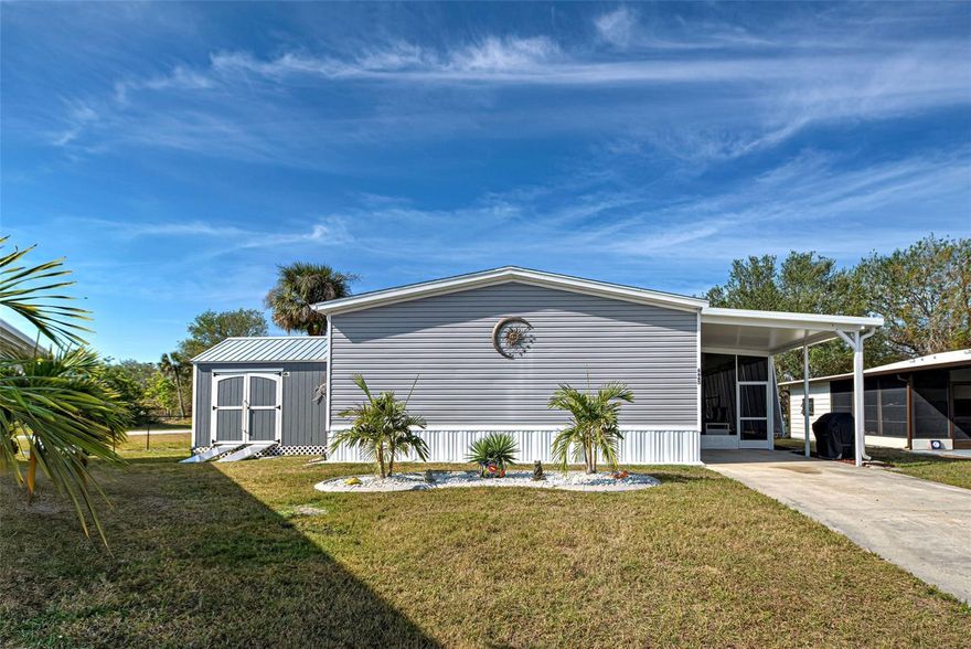 BACK ON MARKET-BUYERS FINANCING FELL THROUGH!!  Welcome to fun and active Holiday Park in North Port Fl.  A +55, Deed Restricted, Golf Cart friendly, manufactured/mobile home community.  Community Clubhouse and 2 heated Pools.  NO LOT RENTAL.  YOU OWN THE LAND.  SO GREAT THAT LAWN MOWING IS INCLUDED IN THE ANNUAL FEE.   This home is located in the PET AREA.   Presenting this sleek and modern, 2023, 1469 sq. Ft., 3/Bedroom, 2/Bath, w/Carport Lanai and Carport.  One more time this is a 2023!  Situated in a cul-de-sac on a nice sized lot.  Floor plan is both contemporary, w/it's Open Floor plan, and unified w/attractive luxury vinyl flooring throughout.  Great room, dining area and kitchen exemplify these points.  Primary Bedroom/En-Suite are separate from the other 2 bedrooms.  Allowing for privacy when having guests.  En-suite is a nice size and includes a closet/storage area.  2nd and 3rd Bedroom's share guest bath.  Both have walk-in closets.  Oops let’s not forget the inside utility/laundry room w/extra cabinets.  Exterior has not been ignored. HANDSOME AND FUNCTIONAL BAHAMA SHUTTERS($7k) on windows and the carport lanai.  They add that “FLORIDA VIBE’.  An excellent addition to this property is the 10x12 Workshop/Shed ($7,200). Yes, it has power.  Handy Jacks and Jill’s will love it.  Holiday Park offers so many activities and amenities.  Clubhouse and 2/heated pools, tennis, pickleball, shuffleboard, fitness, library and more.  The maintenance fee (Special Community District Fee) is included in the annual tax bill for your property.  Holiday Park is located off US 41.  It’s a short drive to shopping and restaurants.  BEAUTIFUL DAYS, BEAUTIFUL NIGHTS, BEAUTIFUL FLORIDA!