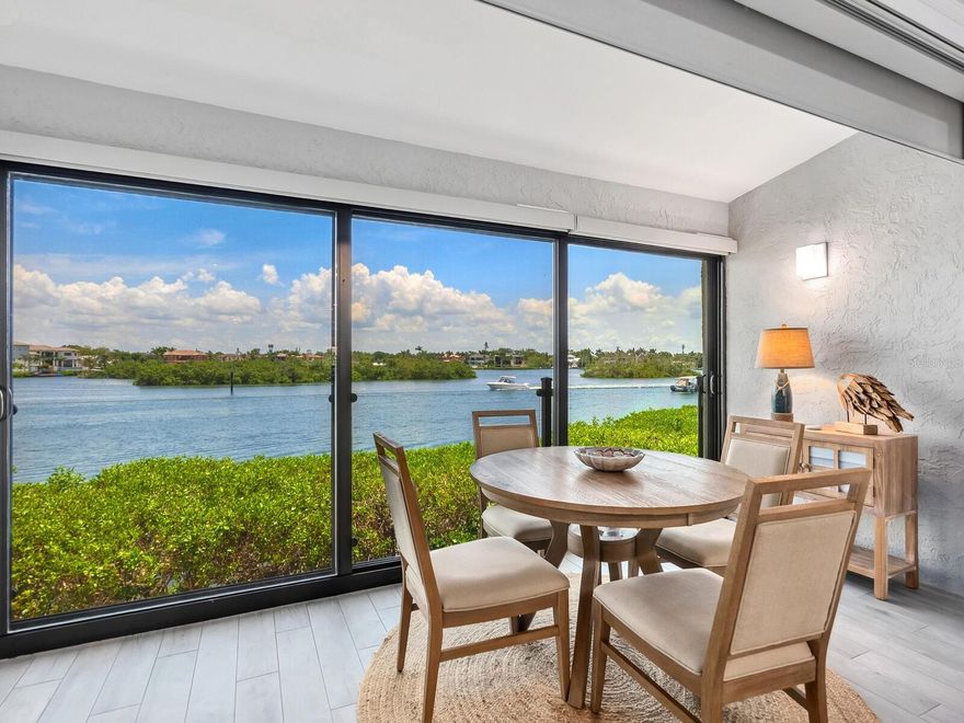 Investment opportunity with strong rental potential—this Siesta Key waterfront villa offers two-week minimum rentals, private deeded beach access, and an oversized private 2-car garage, an exceptionally rare combination. Located in Excelsior Beach to Bay, this updated 2-bedroom, 2-bath residence is set directly on the Intracoastal Waterway and elevated above its garage, capturing panoramic bay views from nearly every room.
The fully furnished, light-filled home features an open floor plan, floor-to-ceiling hurricane-impact glass doors, tile flooring throughout, a remodeled kitchen with white cabinetry and stainless appliances, and a dry bar for easy entertaining. The primary suite enjoys sweeping water views. Recent updates include a new HVAC system and water heater (2024). Store your kayak right under the building for easy access to launching your boat. This community offers convenient access to the south bridge, placing Sarasota's dining, shopping, cultural venues, and medical services just minutes away. This Villa offers the best of coastal living.

This pet-friendly, resort-style community offers pools, tennis and pickleball courts, a fitness center, fishing pier, and private deeded access to Siesta Key Beach. Ideally located near the South Bridge with quick access to Sarasota dining, shopping, and culture—making it equally well suited as a luxury vacation rental, seasonal income property, or personal waterfront retreat.