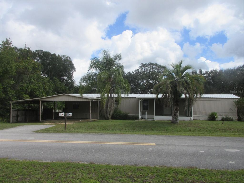 Photo of 5515 SE 182nd Terrace, Ocklawaha, FL 32179 (MLS # OM712418)