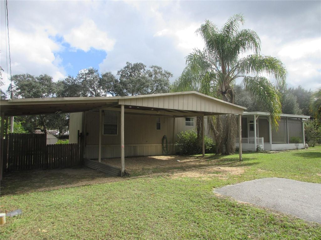 Photo of 5515 SE 182nd Terrace, Ocklawaha, FL 32179 (MLS # OM712418)