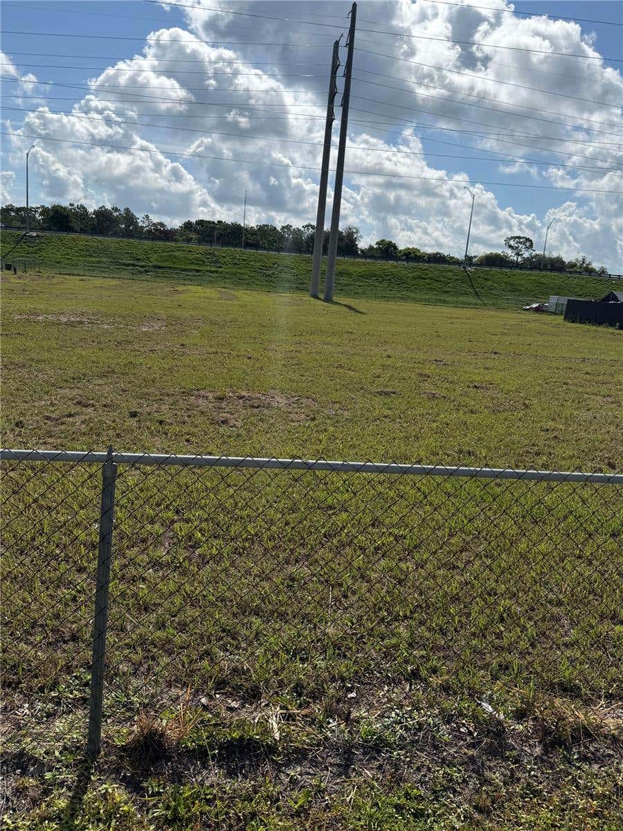 Photo of Econlockhatchee Trail S, Orlando, FL 32825 (MLS # O6433801)