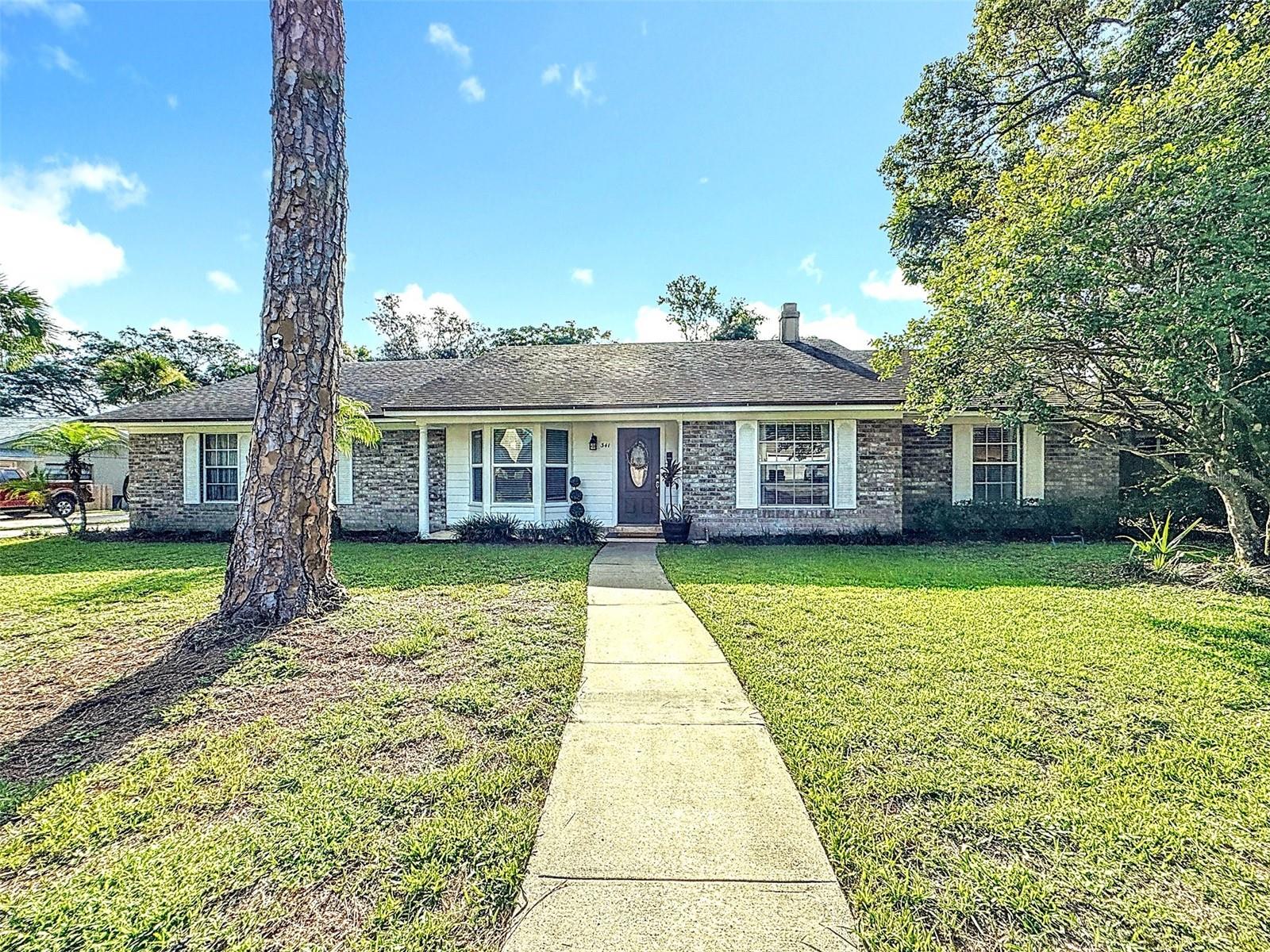 Welcome to this beautiful 4-bedroom, 2-bath home, a true gem that combines modern updates with timeless charm. Nestled in the serene Sabal Point neighborhood, this residence offers an exceptional living experience with its thoughtful design and wonderful finishes. As you step inside, you'll be greeted by the open and airy layout, with a formal living room to the right and a separate formal dining room to the left, creating an inviting sense of space for family or entertaining. The freshly painted walls, adorned in neutral tones, provide a perfect backdrop for your personal style and decor. The updated flooring features a seamless flow throughout the home, adding to its warm appeal. The kitchen is the heart of the home, and this will make cooking a true pleasure. It boasts exquisite granite countertops, an immense number of cabinets that provide ample space for meal preparation and entertaining. The newer stainless steel appliances, including a modern refrigerator, oven, microwave, and dishwasher, are as functional as they are stylish, ensuring that cooking and cleaning are a breeze. The kitchen also has ample space for a couple of barstools at the counter for casual meals. The split plan design offers privacy and convenience, with the master suite thoughtfully separated from the other bedrooms. The master bedroom is a tranquil retreat featuring ample closet space and a beautifully renovated en-suite bathroom. The bathroom showcases a newer vanity with dual sinks, a sleek shower, and contemporary fixtures, creating a spa-like atmosphere. The additional three bedrooms are generously sized, each with large windows that let in plenty of natural light. They share access to a second updated bathroom, complete with a newer vanity and modern amenities, ensuring comfort for family members and guests alike. Entering the back patio, you will be immersed in a retreat with a deep covered lanai. This home offers a recently resurfaced large inground pool with additional patio area, a very spacious backyard with a fire pit, and backs up to conservation. The perfect oasis for outdoor activities and relaxation. Whether you envision hosting barbecues, gardening, or simply unwinding in the fresh air, this backyard offers endless possibilities. The attached 2-car garage adds convenience and extra storage space, making it ideal for your vehicles and other belongings. You will also have complete peace of mind with the newer roof installed in 2019 and A/C in 2020. Wekiva Springs State Park is just 7 minutes away. Located in highly sought-after Sabal Point, home to 85 acres of Sabal Point Commons, and don’t forget the Grade A school district. With its lovely updated features and attention to detail, this home is move-in ready and waiting for you to create lasting memories. Don't miss the opportunity to make this lovely house your new home!