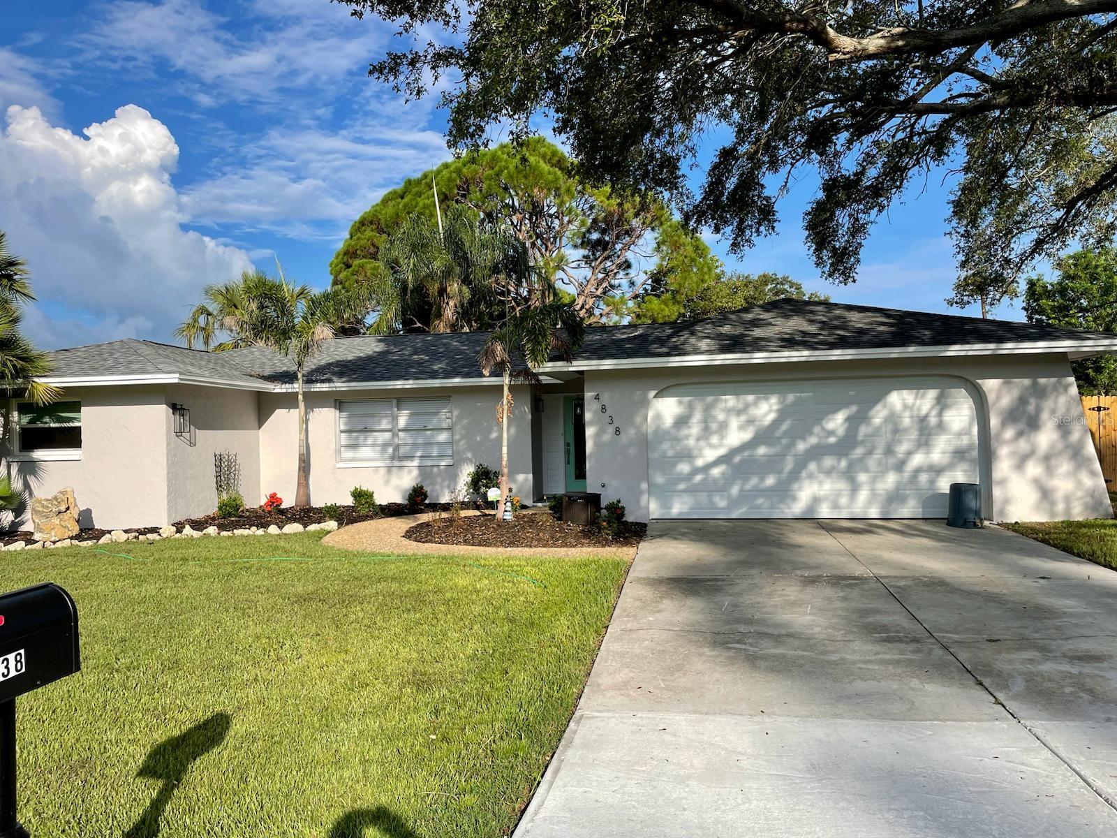 Coastal Freedom Meets Resort Living – No HOA. No CDD. No Stress. Every once in a while, a home shows up that checks every box… but this one erases the boxes entirely. Just fifteen minutes from Siesta Key’s powder-white beaches and the energy of Downtown Sarasota, this fully upgraded, turn-key retreat gives your weekends back to you — no to-do lists, just pure relaxation.
From the moment you arrive, lush palms and fresh landscaping set the tone. Step inside and you’re greeted by a breezy open concept where wood-look tile flows underfoot and sunlight dances across every surface. The chef’s kitchen is a true showpiece, featuring a waterfall-edge quartz island, crisp white shaker cabinets, sleek stainless steel appliances, and an elegant marble subway tile backsplash.
Outside, the magic continues with a heated pool wrapped in new pavers and surrounded by a fully fenced yard, creating your own private resort. Lounge under the palms, fire up the grill, or float under the stars — every day feels like a getaway.
Nearly everything here is new or recently updated, including the roof (2023), AC and air handler (2025), kitchen and baths (2023), pool pump, PVC, and pavers (2023–2024), hurricane sliders and windows (2024), and custom closets throughout (2024). Irrigation, lighting, flooring, and appliances have all been upgraded as well, giving you total peace of mind.
This isn’t just a home — it’s a decision-free zone. No HOA telling you what to do. No CDD adding surprise costs. Just upgraded comfort minutes from beaches, shopping, dining, and I-75. Whether you’re downsizing, starting fresh, or chasing the Florida lifestyle full-time, this property delivers the freedom, location, and easy living you’ve been waiting for. Don’t just view it — feel it. Schedule your tour today and start living where every day feels like a vacation.