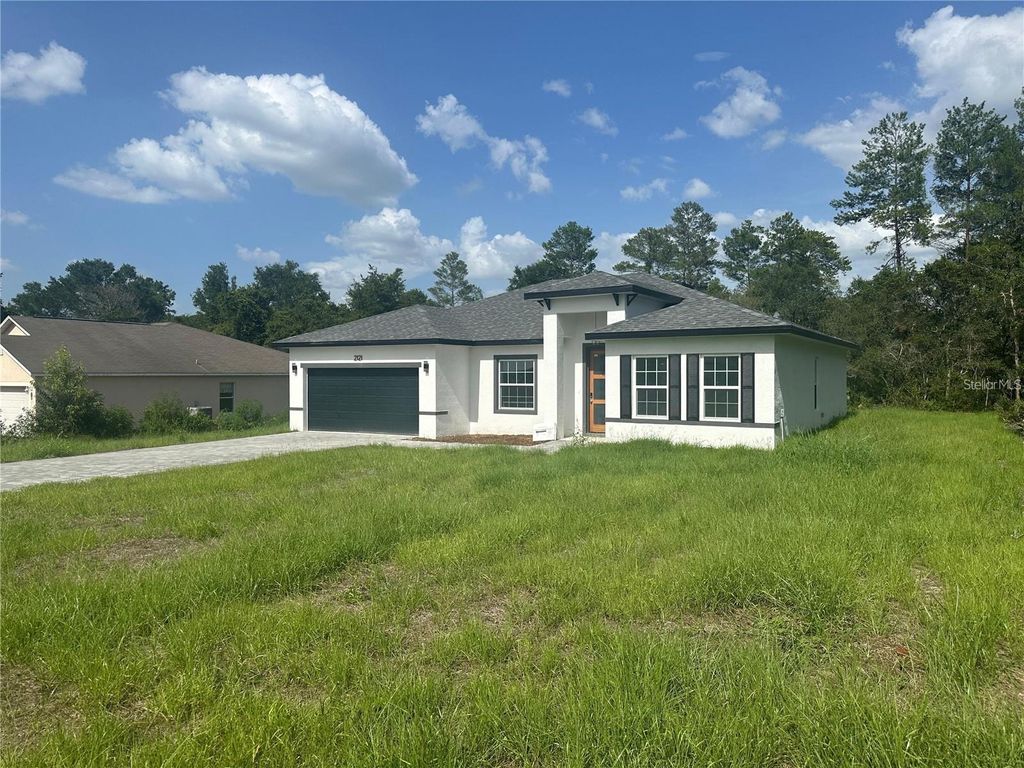 Photo of 2121 SW 153rd Loop, Ocala, FL 34473 (MLS # O6388394)