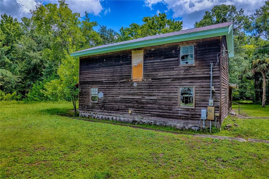 Welcome to your 5-acre private estate to build your dream home away from the hustle and bustle of
the more urban areas of Greater Orlando. The lot has a non-accessible house ready for demolition
and 2 partially constructed out buildings on the lot. The partially cleared lot has extensive
trees and natural features and some wetlands. Duke Energy lines are located on the lot and as well as WELL WATER
which needs updating. Septic also needs updating and an inspection to decipher its condition.
Zoned for horses and other farm animals and agricultural usage. Lot may be able to be subdivided into 2 or more lots with minimum size of 1 acre depending on county approval. Drainage and access study needed to subdivide.  Preapplication with the County needed for this. Not in a FEMA flood zone.  Lot is approx 1/2 wetlands.