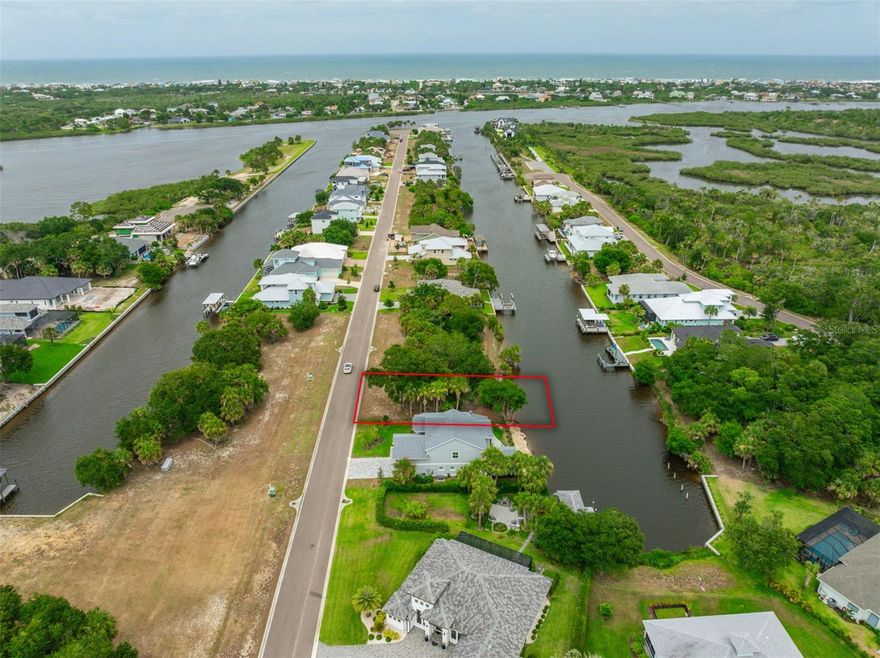 **Prime Saltwater Canal Lot in Exclusive Gated Community** One of the last remaining vacant lots available, this exceptional property offers the perfect canvas to build your dream home. Situated on a saltwater canal surrounded by luxury homes, it provides direct access to the Intracoastal Waterway, ideal for boating enthusiasts. Customize your space with a boat dock and lift for your boat or jet skis, and enjoy great fishing, kayaking, and canoeing right from your backyard. This lot's prime location is just five minutes from the beautiful Flagler Beach, 20 minutes from the vibrant Daytona Beach, and 30 minutes from historic Saint Augustine. For those seeking adventure, it's a little over an hour to Orlando's world-renowned amusement parks. This lot is in a NO FLOOD ZONE X, this high and dry lot sits on a private cul-de-sac street surrounded by luxury homes. Don’t miss this rare opportunity to join an exclusive community and live the waterfront lifestyle you've always dreamed of.