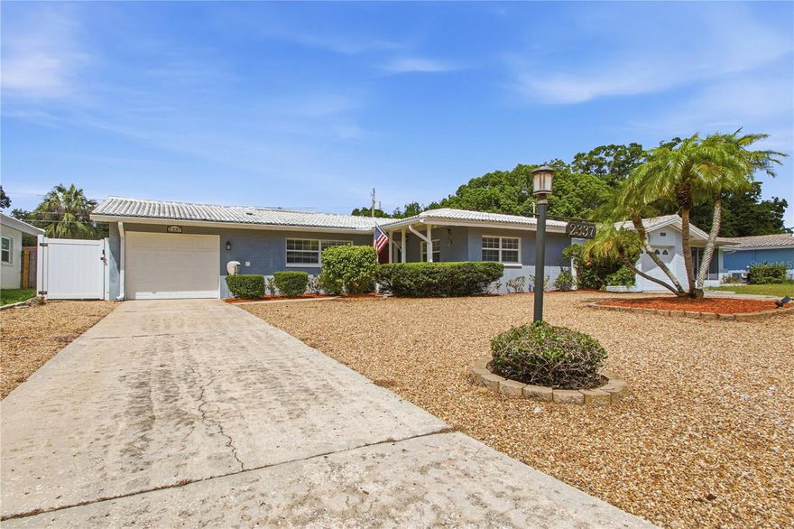 Charming, upgraded concrete-block home in flood zone X (no damage from Helene or Milton). This low-maintenance property offers impressive upgrades and features: Newer mini-splits in the master bedroom and Florida room , 2024 whole-house water softening and filtration system, a 2024 50A generator inlet that includes a 11 KW portable GENERATOR which powers the entire home (central A/C has a soft-start kit to run smoothly on generator power). This home is complete with IMPACT WINDOWS! The Florida room is ideal as a home office! The home also features a modern kitchen, bathrooms, flooring, low-maintenance front yard, an irrigated rear yard with a French drain system for stormwater, and a unique LANAI!. Great proximity to downtown Dunedin AND downtown Safety Harbor. Great house. Great location. Great Florida living.