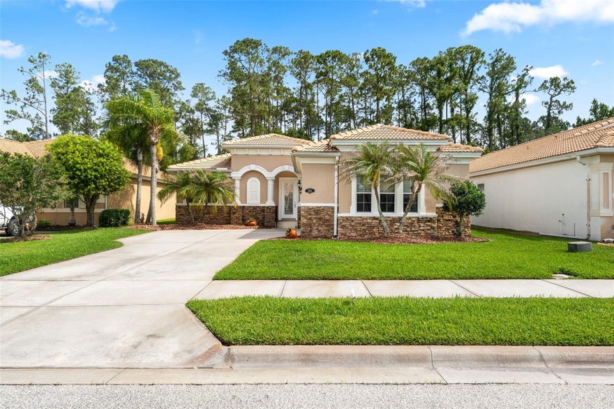 One or more photo(s) has been virtually staged. Imagine living in the Venetian Bay active golf community just 15–20 minutes from the beach, with restaurants, a clubhouse, 24-hour gym, spa, and a resort-style pool with Tiki Bar. This move-in ready, one-story 3-bedroom, 2-bath home with a tiled roof and upgraded front elevation includes a large office/den with French doors—ideal as a flex space. The open-concept layout features crown molding, a spacious kitchen with granite countertops, double ovens, cooktop, pantry, and ample cabinet and counter space, all open to the main living area—perfect for everyday living and entertaining. Enjoy the large enclosed patio and fenced backyard that backs to a conservation area, offering peaceful views and added privacy for pets and family. Recent upgrades include NEW interior and exterior paint, NEW carpets, NEW water heater, and NEW cooktop. The A/C and refrigerator are only 4–5 years old. Life here feels active and social, with walking and biking trails, pickleball courts, parks, lakes, fountains, and a vibrant town center with a farmer’s market and community events for all ages. Just a short drive to I-95, I-4, SR-44, and SR-415, with easy access to Port Orange and Daytona Beach.