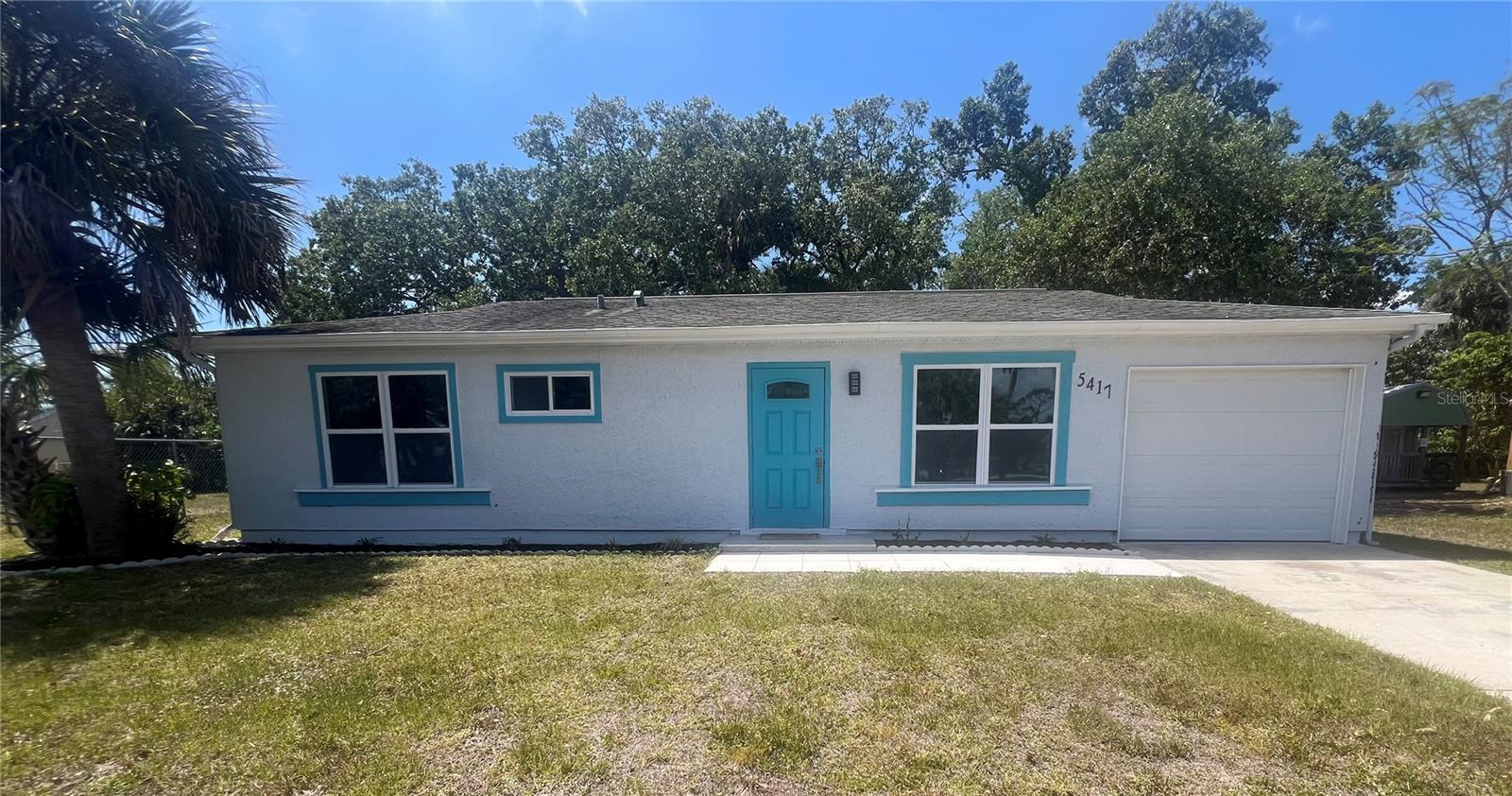 Why rent when you can own? Nothing to do but move into this Luxury Renovation directly across from a Park. Come tour this charming ranch home that has been upgraded with top-of-the line finishes. The kitchen has gorgeous quartz countertops, new soft-close cabinets, new appliances, tile backsplash and a view of your private backyard. Open concept living with lots of bright light. Feel safe and secure with brand-new hurricane impact windows and sliding glass door. Both bedrooms have new fans and good-sized closets. The bathrooms are jack and jill style with a shared bathtub. New vanities and tile shower. Entire home has beautiful porcelain plank tile, including the back deck. Washer and dryer hookups are located in the attached one car garage. No need for a playground or volleyball court, these amenities are directly across the street at Pine Park. Located in a convenient neighborhood with shopping and dining less than .15 miles away. This is a perfect property to call home!