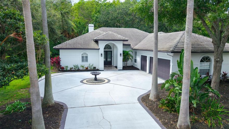 Welcome to your UPDATED, bright, and contemporary retreat in the PREMIER GATED and GUARDED golf community of CHEVAL in the “A” rated STEINBRENNER school district! This beautifully updated 4 BEDROOM, 3 FULL BATH, 1 HALF BATH  PLUS LARGE OFFICE/5TH BEDROOM home. ELEGANT DOUBLE GLASS FRONT DOORS leading into a spacious, light-filled layout! The family room highlights a floor-to-ceiling CONTEMPORARY STONE WOOD BURNING FIREPLACE with mantel and POCKET SLIDING DOORS that open completely to the lanai. The CHEF’S KITCHEN is both stylish and practical, featuring GRANITE countertops, an island, breakfast bar seating for four, SOFT CLOSE CABINETS AND DRAWERS and stainless steel APPLIANCES ONLY 3 YEARS OLD. GENEROUS eat-in area and formal dining space. TWO EXPANSIVE PRIMARY SUITES. The first master suite features POCKET SLIDING DOORS the pool area, HUGE double WALK IN CLOSETS, JETTED JACUZZI TUB, separate glass enclosed oversized shower, makeup station, dual vanity, The SECOND MASTER SUITE has a SEPARATE A/C UNIT, three large windows, a tub/shower combo and TWO LARGE CLOSETS including one walk-in. THREE FULL BATHS showcase GRANITE countertops and soft close drawers and cabinets. Step outside to your own PRIVATE OASIS—a LARGER THAN AVERAGE SALT WATER HEATED POOL with resurfaced finish and tiled jacuzzi spillover (2022), OUTDOOR KITCHEN plus a pool bath for added convenience. BRIGHT 3 CAR SIDE-ENTRY with OVERHEAD STORAGE and a LARGE CIRCULAR DRIVEWAY.  Set on a PRIVATE CONSERVATION LOT with abundant windows and sliding glass doors fill the interior with NATURAL LIGHT and showcase the lush surroundings. Residence can enjoy two championship golf courses, clubhouse, restaurants, fitness center, community pools, and tennis courts. Enjoy the best of both worlds—privacy and convenience, elegance and comfort, in a community designed for an exceptional lifestyle.