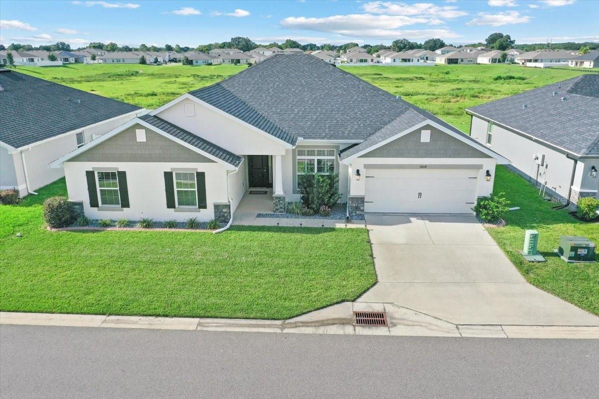 Location is key to this 3000 model built by Adams Homes in Brookhaven subdivision. This spacious open and airy home backs up to a large conservation area. So many nice features in this large model: LR area with vaulted ceilings off the foyer. The very large kitchen is perfect for entertaining with kitchen island & granite countertops and an attached Pantry Room for all you chefs out there, The pantry is also connected to utility room with out door access. The kitchen also connects to huge great room with soaring vaulted ceilings. The huge primary bedroom sports a sitting area and tray ceiling, connecting to the bath suite which has dual vanities, walkin shower and separate soaking tub, with plenty of closets. Wood plank tile floors accent the baths and kitchen in this home. Brookhaven subdivision has a low HOA fee, dog park, community pool and playground and is conveniently located to shopping, restaurants, hospitals, close to rainbow river, WEC (World Equestrian center) with the Gulf coast approx 40 miles to watch sunset, Silver Springs State Park on the way to Daytona beaches with a beautiful drive through the Ocala forest approx 90 miles.
