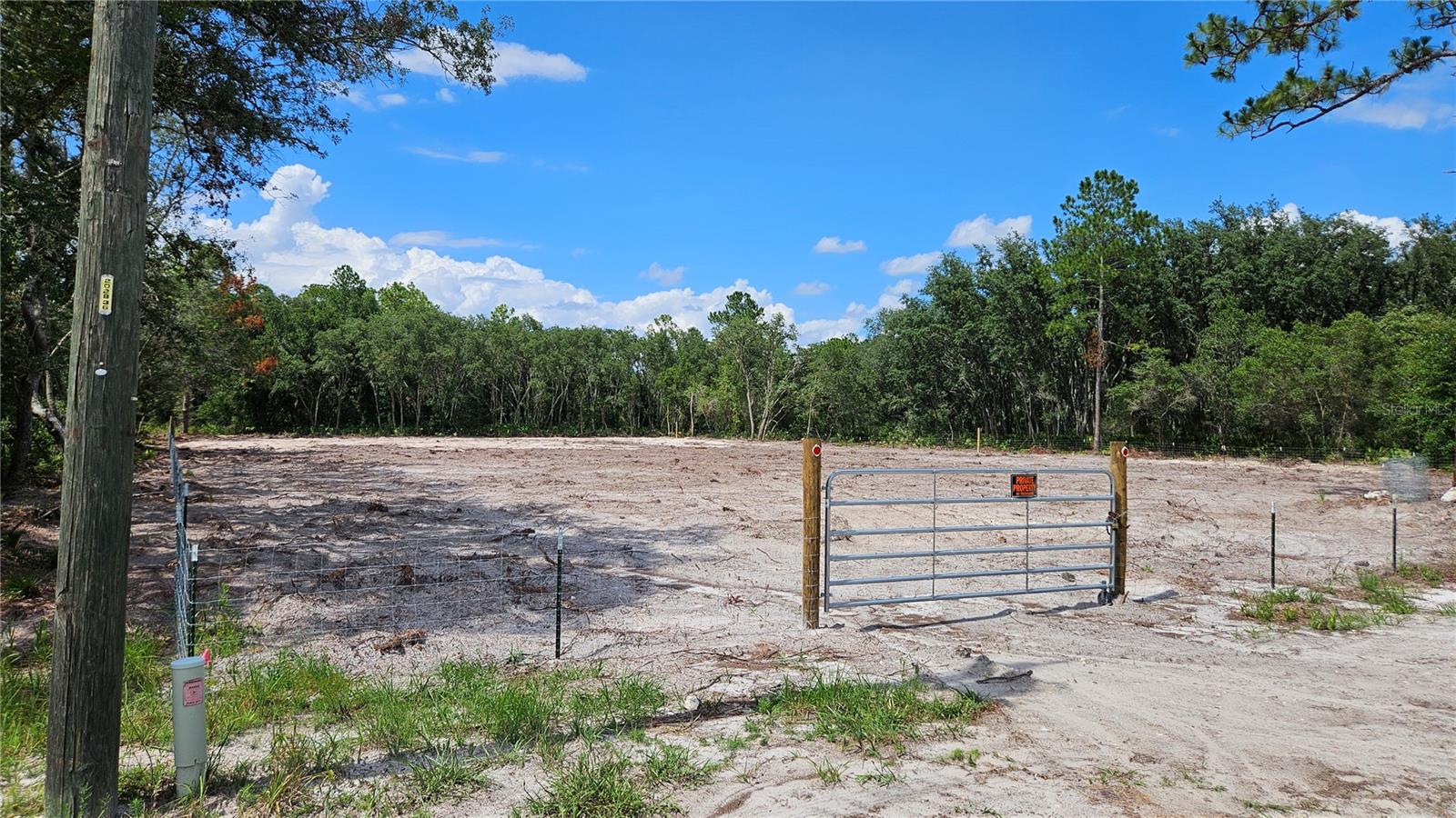 Beautiful 1.16-acre home site, all cleared and fenced, with electricity available on the utility pole right at your front door. This Ridge Manor Estates lot is ready to be built on. Discover the perfect blend of country and charm. This land is primed for you to construct your dream farmhouse. Envision your life here, where an alluring dirt driveway off a paved road leads to your future homestead, surrounded by nature, oak trees and lush vegetation. Conveniently located just 50 minutes from downtown Tampa, 18 minutes from the heart of Dade City, and a short distance from Bushnell, Ridge Manor, San Antonio and Brooksville - all charming small towns. This property offers not just a place to live, but a lifestyle. Embrace the serene country life you’ve always dreamed of. It is ideal for those who dream of peaceful country living with the convenience of city amenities within reach. This property won't last long on the market, so come to see it while it is still available.