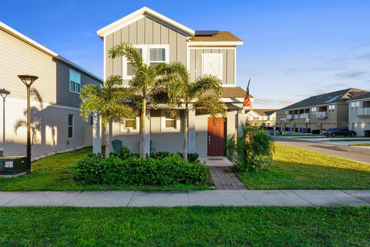 Immaculate modern classic 3 bedroom and 2.5 bathroom two-story home nestled on a premium corner lot located on a quiet street just steps away from the resort style amenities in the sought after residential community of Tohoqua. The Autumn exudes elegance and good taste. As you enter, you are greeted by ample open space with lots of natural light flowing through. The modern style open kitchen features stainless steel appliances, a large island with quartz countertops that opens to the elegant dining room and spacious family room with wall-to-wall wood like tile planks. This wonderful home features a back porch with a detached rear load 2-car garage, a fenced-in side yard, a laundry room that includes a washer & dryer, a convenient half bathroom on the first floor, a spacious master suite with a large walk-in closet, and a spa inspired master bathroom with his/hers sinks and a glass enclosed shower. This home is green energy efficient thanks to solar panel technology that helps reduce the electric bill. At Tohoqua, families can utilize the resort-style swimming pool, clubhouse with a fitness center, and tennis and pickle ball courts along with walking trails throughout the community.