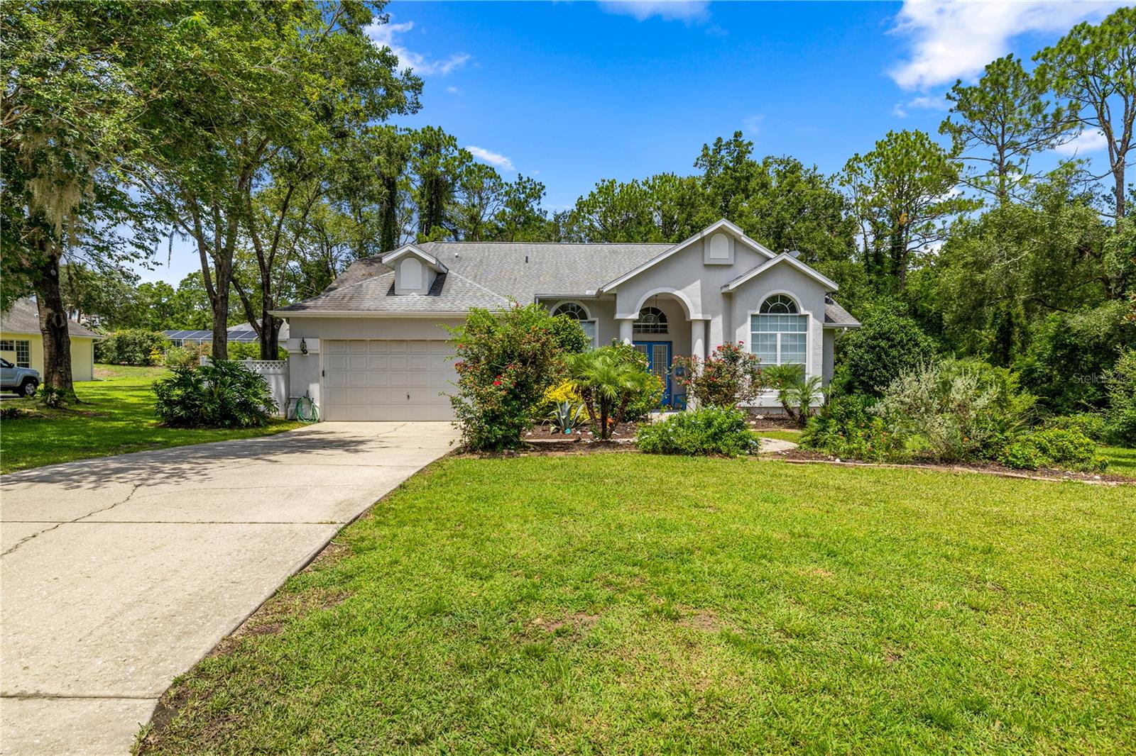 Florida Living at Its Finest in Rainbow Springs!
Welcome to your slice of paradise in the heart of Dunnellon! Nestled in the sought-after community of Rainbow Springs, this beautifully maintained 3-bedroom, 2-bath pool home offers 1,902 square feet of classic Florida charm and indoor-outdoor living.
Step inside to discover a bright, airy floor plan with formal living and dining rooms, perfect for entertaining or relaxing with loved ones. The master suite is a true retreat with a tall sunlit window, cozy window seat, and direct access to the pool area. Enjoy the spa-like master bath, featuring dual sinks, a jetted soaking tub, walk-in shower, and a private pool entrance for those early morning swims.
The heart of the home is the oversized kitchen, recently updated with soft-close cabinetry and drawers and tons of counter space. It opens to a spacious family room bathed in natural light from skylights and large windows. A generous bar seating area makes this space ideal for gathering with friends and family.
Two additional bedrooms are tucked away off the family room behind a pocket door, creating a private guest wing. The shared guest bathroom is conveniently located between the rooms for easy access. The indoor laundry room offers a deep sink and abundant cabinetry, making everyday chores a breeze. Home also has a full home generator
Step outside and soak up the Florida sunshine in your screen-enclosed pool area, complete with a kidney-shaped heated pool, outdoor kitchen, and tall screen cage — perfect for summer fun and poolside dining. The lush backyard boasts fruit trees, including a Honey bell orange and persimmon tree, adding to the tropical appeal.
Enjoy access to Rainbow Springs’ private residents’ park, nature trails, and the crystal-clear spring-fed river — all just minutes away.
Whether you're looking to relax, entertain, or simply enjoy the Florida lifestyle, this home checks all the boxes. Don't miss your chance to own a piece of paradise!
