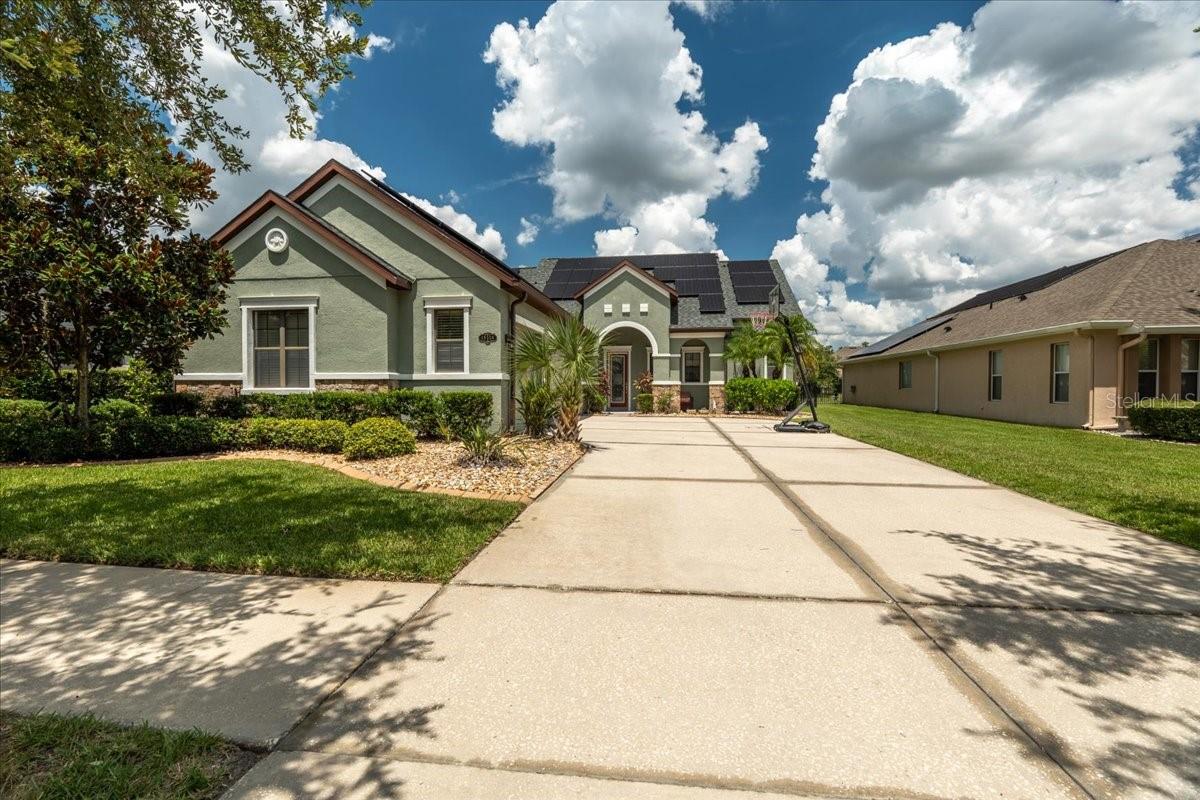 This stunning two-story residence offers 3 spacious bedrooms and 2.5 baths, perfectly blending style, comfort, and modern upgrades. Situated on a generous lot, the home features a side-entry 3-car garage and a sparkling in-ground pool with a covered lanai, paver deck, and plenty of space for outdoor entertaining. Inside, you’ll find a mix of elegant ceramic tile and plush carpeting, a gourmet kitchen with a countertop range, double ovens, over-the-range microwave, granite countertops, and a water softener. The home is equipped with surround sound speakers, and the entire interior has been freshly painted, giving it a crisp, move-in-ready feel. Major systems have been recently updated, including a dual-zone AC system with both units less than 5 years old, a 1-year-old water heater, and a roof replaced less than a month ago. For incredible energy efficiency, the property boasts 50 solar panels, keeping utility costs low. Nestled in the highly desirable K-Bar Ranch neighborhood, this home combines resort-style amenities with everyday convenience, making it a rare find in today’s market.