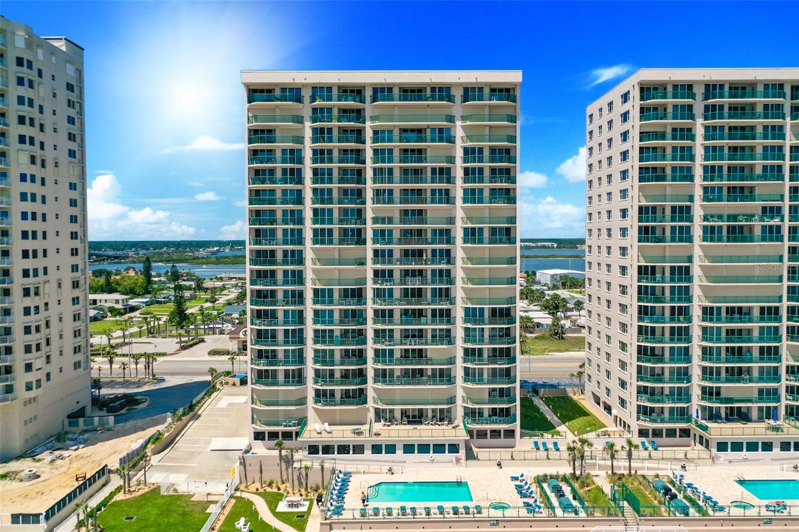 COME HOME TO THIS ELEGANT, MODERN TAKE ON RELAXES BEACHFRONT LIVING IN THS SE CORNER OCEANFRONT PLAN WITH PANORAMIC OCEANFRONT VIEWS THAT ENCOMPASS THE GREAT ROOM. EXQUISITE CONDOMINIUM HOME OVERLOOKING THE ATLANTIC OCEAN WITH AN ABUNDANCE OF NATURAL LIGHT AND MULTIPLE AREAS OF LOUNGING SPACES. THE OPEN CONCEPT LIVING AREA WITH TILE FLOORING SEAMLESSLY BLENDS INTO THE GOURMET KITCHEN WITH GRANITE COUNTERS AND FULLY INTEGRATED APPLIANCES. FEATURING 3 SPACIOUS BEDROOMS, EACH WITH THEIR OWN BATH AND WATER VIEWS. THE SUNSET ENTRY FEATURES A FLEX AREA THAT COULD BE A DEN, A WORK FROM HOME SPACE OR BREAKFAST ROOM. THE LIVING AND DINING AREAS PROVIDE VIEWS TOWARD THE OCEAN THAT PERFECTLY CAPTURE THE COASTAL LIFESTYLE. AN INDOOR LAUNDRY, STORAGE CLOSET AND PREMIER PARKING SPACE COMPLETE THIS TRUE GEM, NOT TO BE MISSED. 2 OCEANFRONT SWIMMING POOLS, CLUB ROOMS, FITNESS CENTERS IN AN IDEAL LOCATION IN DAYTONA BEACH SHORES, A BRIDGE AWAY FROM ALL THE SHOPS AND RESTAURANTS THAT PORT ORANGE OFFERS/
Square footage received from tax rolls. All information intended to be accurate but cannot be guaranteed.