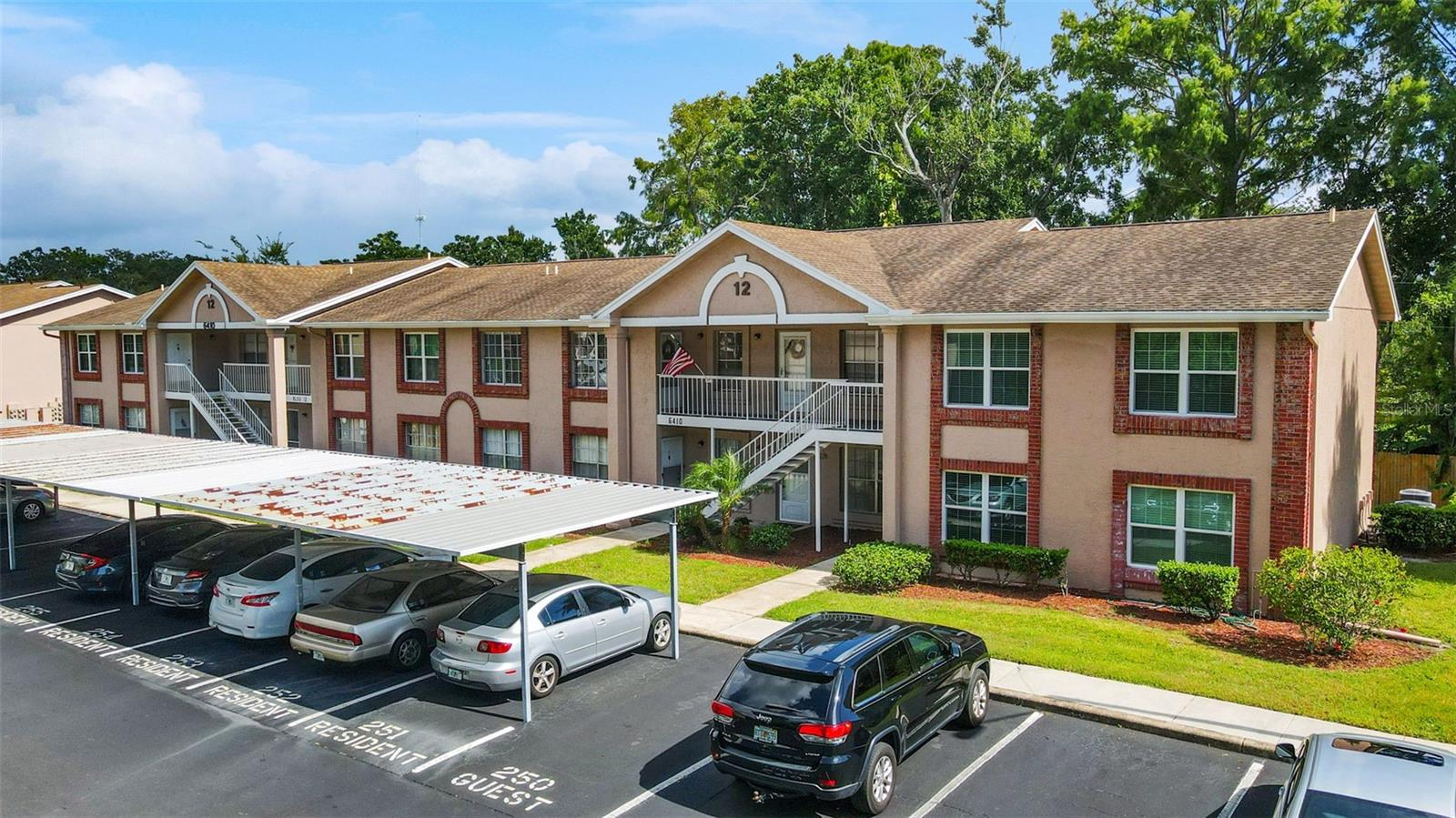 Welcome to this stunning 2 Bedroom, 1 and a ½ bathroom maintenance free condo offering endless upgrades and located in the highly sought after 55+ community of Sunnybrook. As you step inside you will immediately notice an open-floor plan loaded with natural light, volume ceilings and white oak luxury vinyl flooring throughout. The fully remodeled kitchen includes stainless steel appliances, solid wood cabinets, granite countertops, recessed lighting, and a beautiful sliding barn door over the pantry closet. All of this opens to a screened patio perfect for a peaceful morning coffee. Both bathrooms include new cabinets and gorgeous stone countertops, new sleek fixtures, new toilets and a walk-in shower. The ½ bath is donned with charming shiplap walls. This condo includes New Air conditioner (2023), covered carport, stackable washer and dryer, and storage closet on the patio. The meticulously maintained community has its own on-site maintenance staff and offers Resort Style Amenities including an active clubhouse, large heated pool and hot tub, pickleball, tennis , bocce ball and shuffleboard courts. Low HOA Fees at just $320/month cover: water, trash, lawn care, exterior maintenance and common grounds. Enjoy a relaxed Florida lifestyle close to shopping, dining, world class golf and the beautiful Gulf Coast Beaches, all within easy reach of Tampa International airport. This is a REAL SHOWSTOPPER!