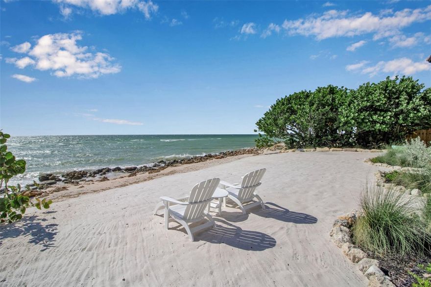 Directly fronting the turquoise waters of the Gulf, this newly remodeled Spanish Mediterranean estate on North Casey Key offers the rare luxury of your own private beach just steps from the home. Set along one of Florida’s most exclusive barrier islands, the property captures sweeping sunset views and exceptional privacy while remaining minutes from the dining, shopping, and cultural attractions of Venice and Sarasota.
Behind a gated entry, the residence features three bedrooms and three-and-a-half baths, thoughtfully remodeled to highlight its Gulf-front setting. Expansive windows and sliding glass doors frame breathtaking water views and fill the interiors with natural light and coastal breezes.
Architectural details include wood beams and moldings, Mexican tile and wood floors, brick accents, hand-painted stair tiles, and hurricane-impact windows and doors. Recent updates include a new roof, new pool, and updated A/C and pool equipment.
The gourmet kitchen features custom cabinetry and Wolf appliances, ideal for entertaining after a day on the private beach. The primary suite offers a sitting room, wet bar, soaking tub, walk-in closet, and a private balcony overlooking the Gulf. Two en-suite guest bedrooms provide comfort and privacy for visitors.
A spiral staircase leads to a rooftop deck with panoramic views of the Gulf and Intracoastal Waterway. Outside, the courtyard-style pool and tropical gardens create a serene retreat just steps from the shoreline.
Experience the privacy, beauty, and unmatched lifestyle of Gulf-front living on Casey Key.