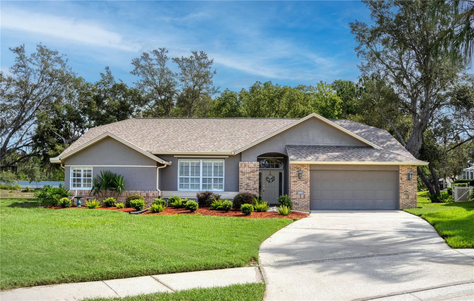 Beautifully custom-built single-family home located in the desirable Rosewood community. The spacious split-floor plan offers comfortable living areas, perfect for relaxing or entertaining guests. Enjoy cooking in the well-appointed kitchen, with ample storage and plenty counter space. The three bedrooms provide peaceful retreats, with plenty of natural light and closet space. Elegant plantation shutters on all the windows. The master bathroom features dual sinks, a walk-in-shower, a separate soaking tub and a water closet.
Enjoy the tranquility of nature and the privacy of no rear neighbors from your own screened-in patio, perfect for relaxing or entertaining. This community has low HOA fees and no CDD fees, making it an affordable and a cost-effective choice. Rosewood at River Ridge is a sought-after community known for its tranquility and friendly atmosphere. Conveniently located near the Suncoast Pkwy extension, residents have easy access to major transportation routes, making commuting a breeze. This home is a must-see for anyone seeking a comfortable lifestyle in a desirable location. Don't miss out on this incredible opportunity to make this, your new home!