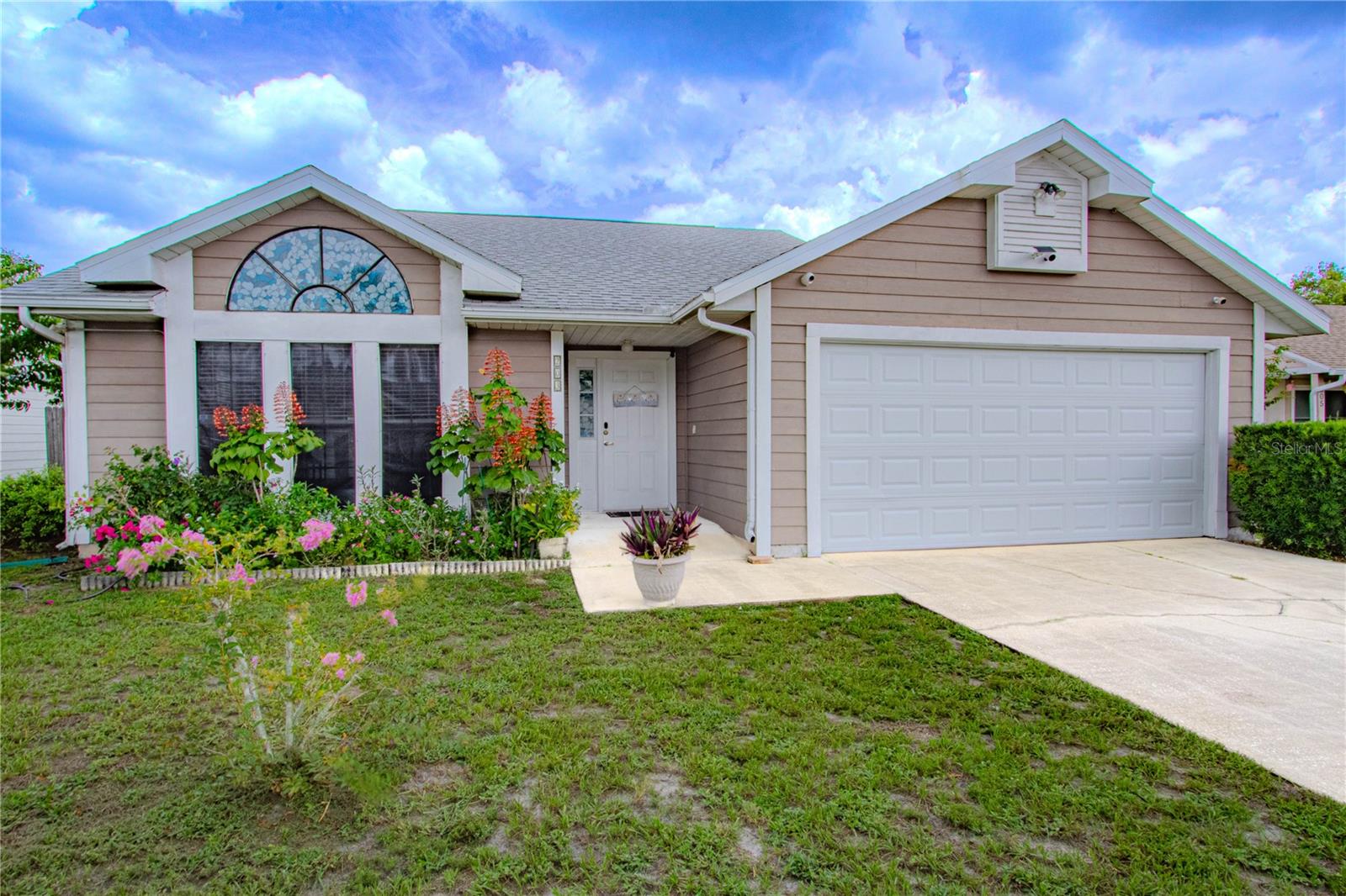 Charming, Move-In Ready Home in the Peaceful BrynHaven Community
Welcome to this beautifully maintained 3-bedroom, 2-bathroom gem, nestled in the quiet and established neighborhood of BrynHaven. With fresh upgrades and a spacious layout, this home is truly ready for you to move right in and start making memories.
Step inside to a bright and airy living room featuring soaring vaulted ceilings and abundant natural light pouring in through large windows. The seamless flow into the dining area, which easily fits a table for six, makes hosting family and friends a breeze. Just off the dining room, the kitchen offers both style and function with a breakfast bar perfect for casual meals or morning coffee.
Down the hall, you’ll find three comfortable bedrooms, including a spacious primary suite with a stunning walk-in tiled shower and an updated counter-height vanity. Two additional bedrooms share a convenient full hallway bath, ideal for guests or family members.
Open the French doors off the dining room and step into your private screened-in patio—a perfect spot to enjoy Florida’s year-round sunshine. Just beyond, a paver patio and lush landscaping, including a fruit-bearing loquat tree, create an inviting outdoor retreat.
Recent updates include a new A/C (2023), new water heater (2021), new roof (2025), new laminate flooring (2025), and a whole-home water filtration system—ensuring comfort, efficiency, and peace of mind.
Located just 15 minutes from Sanford International Airport, Historic Downtown Sanford, the Sanford Riverwalk, and with easy access to SR 417, this home offers both convenience and charm.
Don’t miss your chance to own this move-in ready beauty—schedule your showing today!
