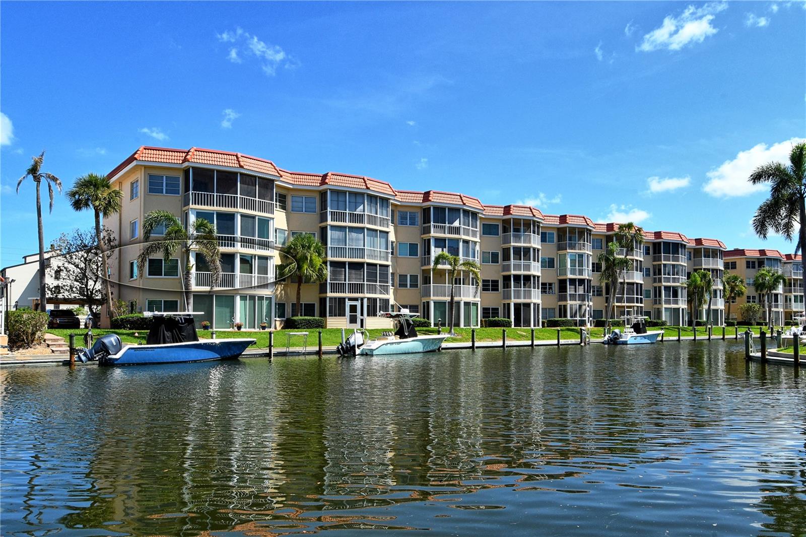 Second Floor CORNER END UNIT ON THE CANAL! This is the One You've Been Waiting For on Siesta Key, 2 bedroom 2 bathroom condo next to the Heated Pool and an easy walk across the street to our Private Beach Access through Crescent Arms! Welcome to this delightful, ready to move in 2-bedroom, 2-bath canal front condominium, ideally situated near the Stickney Point Bridge on Siesta Key. Easy on and off the island. Gorgeous granite countertops with a large open kitchen area including bar seating. Absolutely Stunning Porcelain floors throughout the kitchen, living area, bedrooms, hallway and entry. Gorgeous completely renovated bathrooms with Granite countertops in light brown tones and stunning showers. This condo has everything that you will need to move right in. If you are looking for a vacation home with a water view or retiring to a warm climate with a breeze - This is it! Dock your boat at our Harbor for a reasonable fee, clean your fish at one of the many Fishing Stations at our Harbor and enjoy the Deep Water Canal leading directly to the Sailboat Water of the Intracoastal Waterway. Have your morning coffee on the lanai and enjoy the breeze or close the Impact windows and work from your lanai with no distractions, just a breathtaking water view. You'll love how conveniently located you are to exceptional restaurants, Siesta Key Village and the natural beauty of Siesta Key Beach – an easy walk directly across the street. This condo boasts a spacious open floor plan adorned with extra windows since it is an end unit, bathing the dwelling in warm, natural light. The contemporary new flooring adds a classic touch to the layout. Among its foremost features, this unit comes with Impact Windows, a new Air Conditioner, a dedicated carport parking spot, outside storage space and enjoys amenities like a community pool, fitness center, and laundry on the second, third and fourth floors. Elevate your living experience in this beach home, and enjoy all the benefits and convenience it offers. Don't miss this chance to reside in one of the best locations in Sarasota! Active community with lots of activities in season, private beach access directly across the street. The location is wonderful, scat and trolley right outside your door, easy on and off the key, this is an over 55 community! Close to the Heated pool, clubhouse, Grills, outdoor spa, saunas, fishing pier on the Intracoastal Waterway with a great seating area, Exercise Room, Library and Shuffleboard Courts! This is a great community. You Deserve Paradise!