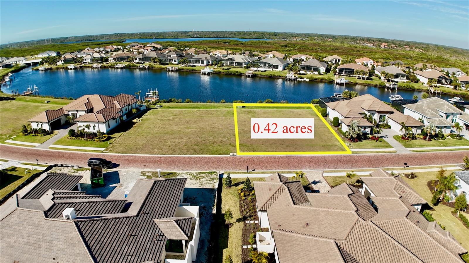 This property is APPROVED FOR A BOAT DOCK AND LIFT. This community is Flood Zone X, which was not flooded during Hurricanes Helene and Milton. This BOATING COMMUNITY is consistently rated #1. Build your dream home and enjoy daily waterfront views, hop on your boat from your backyard, or go for a round of GOLF. You can do it all! The GULF OF MEXICO is only a 35-minute boat ride away. This property is conveniently located and allows for a 10-minute drive to Lakewood Ranch, a 20-minute drive to Sarasota, a 30-minute drive to St. Pete, or a 40-minute drive to Tampa. The dock is deeded and can be built with your home. GOLF membership is available through The River Wilderness Golf & Country Club. The Club at River Wilderness is a semi-private Golf & Country Club located on Florida’s Suncoast in the Manatee-Sarasota County area. The Club features an 18-hole championship golf course, a fully equipped athletic center, tennis courts, pickleball courts, a Junior Olympic-size swimming pool, and a grand clubhouse featuring extraordinary dining and banquet and catering facilities. The Club is located inside the gates of River Wilderness, a gorgeous golf community. *All information is deemed reliable. Buyer or buyer agent responsible for due diligence to confirm all information.*
