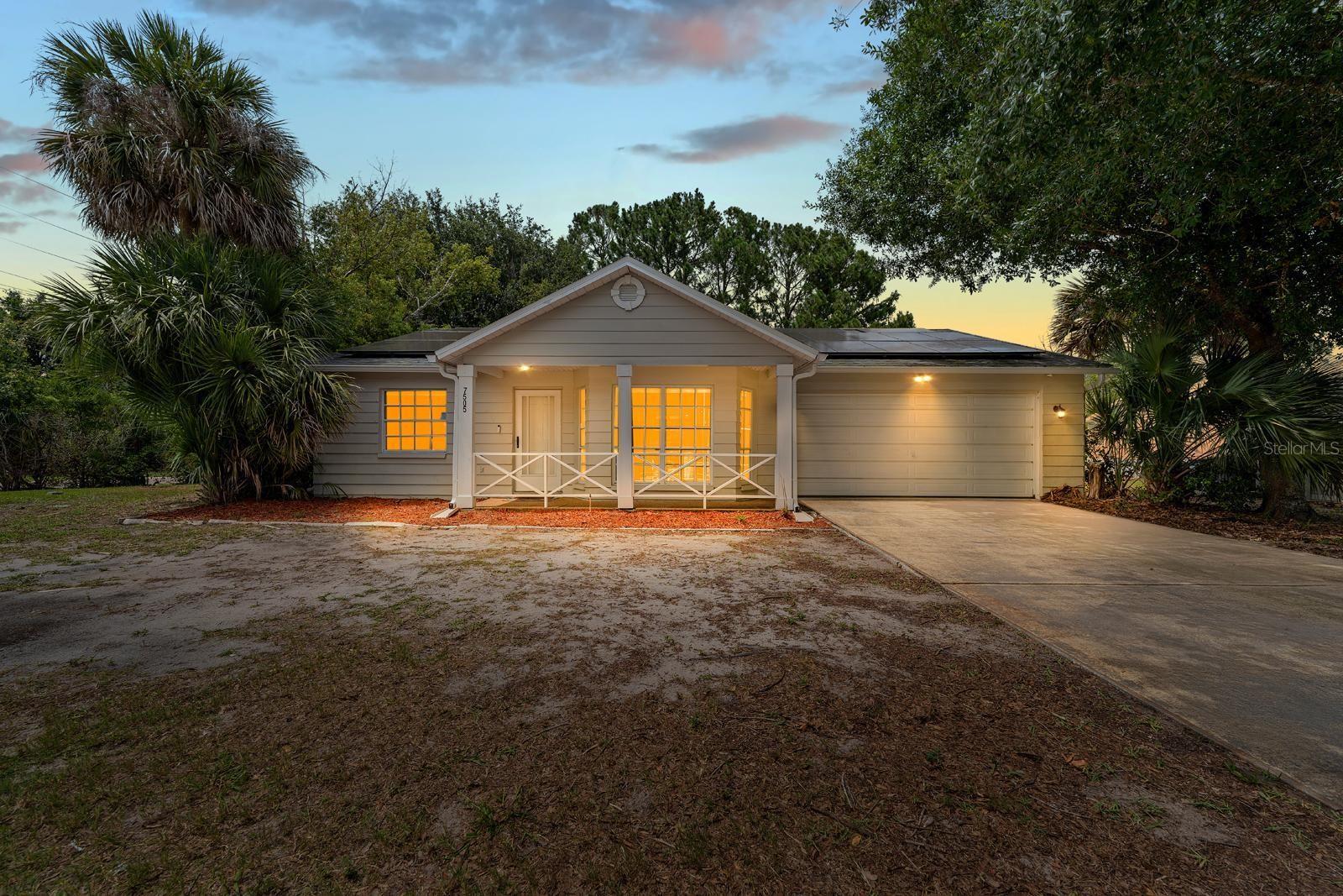 One or more photo(s) has been virtually staged. Welcome to Orchid Lake Village! This beautifully UPDATED optional THIRD BEDROOM home sits on an oversized, PRIVATE waterfront corner lot with NO HOA. The fully FENCED in yard offers plenty of space for pets, entertaining, or future possibilities. Inside, you’ll find LAMINATE flooring in the main living areas, LARGE windows that fill the home with natural light, and updated fixtures and fans throughout. The kitchen is a standout with shaker cabinets, high-end GRANITE countertops, GE appliances, and a charming bay window. The guest bathroom has been fully renovated with new fixtures and a modern vanity, while the primary bedroom features a stylish barn door leading to a recently updated ensuite bath. An enclosed lanai adds extra flexibility, perfect as a THIRD BEDROOM, office, or bonus room. Additional upgrades include a new roof (2019), HVAC system (2022) with a 10-year warranty, a brand-new water heater (2025), SOLAR PANELS, a spacious two-car garage, WATER SOFTENER/CONDITIONING system and a Samsung washer and dryer. For added peace of mind, the home comes equipped with an ADT security system, four cameras, and a doorbell. Conveniently located just minutes from Marchman Technical College, shopping, restaurants, and easy highway access — this is a property you won’t want to miss! NO FLOOD INSURANCE REQUIRED!!