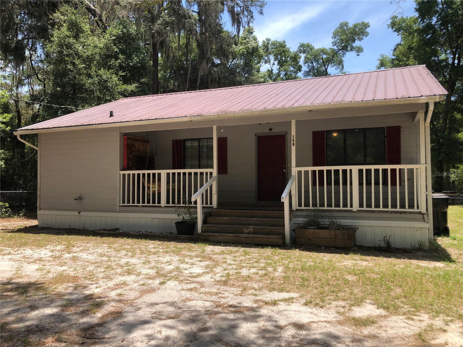 A spacious 3 bedroom, 2 bathroom home on approximately 0.8 of an acre, located on a quiet dead-end road behind Melrose Cemetery. This home features central heat and air, a screened-in back porch, an open front porch, a swing set, and a storage shed in the backyard. Inside, you'll find a stove, refrigerator, microwave, and dishwasher, along with an indoor utility room with washer and dryer hookups. Utilities include Clay Electric and Melrose Water Association. Enjoy peaceful living with room to spread out—schedule your showing today!