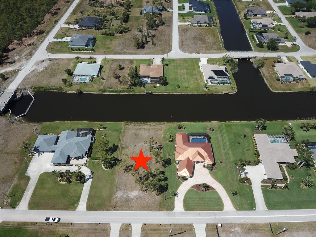 Photo of 1190 Boundary Boulevard, Rotonda West, FL 33947 (MLS # C7508590)