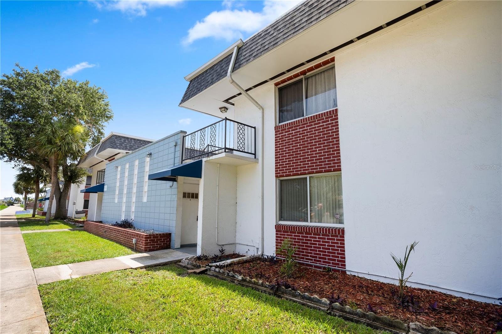 Welcome to this well-maintained two-bedroom, one-bath unit in a super convenient location! With over 800 square feet of thoughtfully designed living space, this home offers comfort, convenience and a central location near beaches, local colleges, shopping, dining and major employers. Go inside and enjoy the bright, open layout, ideal for relaxing or spending time with guests. The living area flows easily into the kitchen and dining space, offering a practical setup for everyday living. Both bedrooms provide comfortable space and privacy, while the bath is clean and functional with a simple, easy-to-navigate layout. A standout feature is the in-unit washer and dryer hookups (small additional HOA fee for water), adding a level of convenience that makes daily routines easier. Plus, the ground-floor location provides easy access with no stairs—ideal for all types of lifestyles. Recent updates including a new roof and new air conditioning system add peace of mind and comfort to everyday life. Go outside and enjoy a peaceful wood deck courtyard, a great place to unwind in the evening, read a book or connect with neighbors. A reserved, covered parking spot is provided at the rear of the complex. The location can't be beat. You're just minutes from Daytona Beach's beautiful shoreline, popular local eateries, shopping centers, area schools, healthcare and recreational attractions. With everything so close by, you'll enjoy a lifestyle that balances convenience and relaxation. Whether you're looking for a primary residence, a seasonal home or an investment property, this condominium is a great choice for those seeking low-maintenance living in a vibrant and centrally located community.