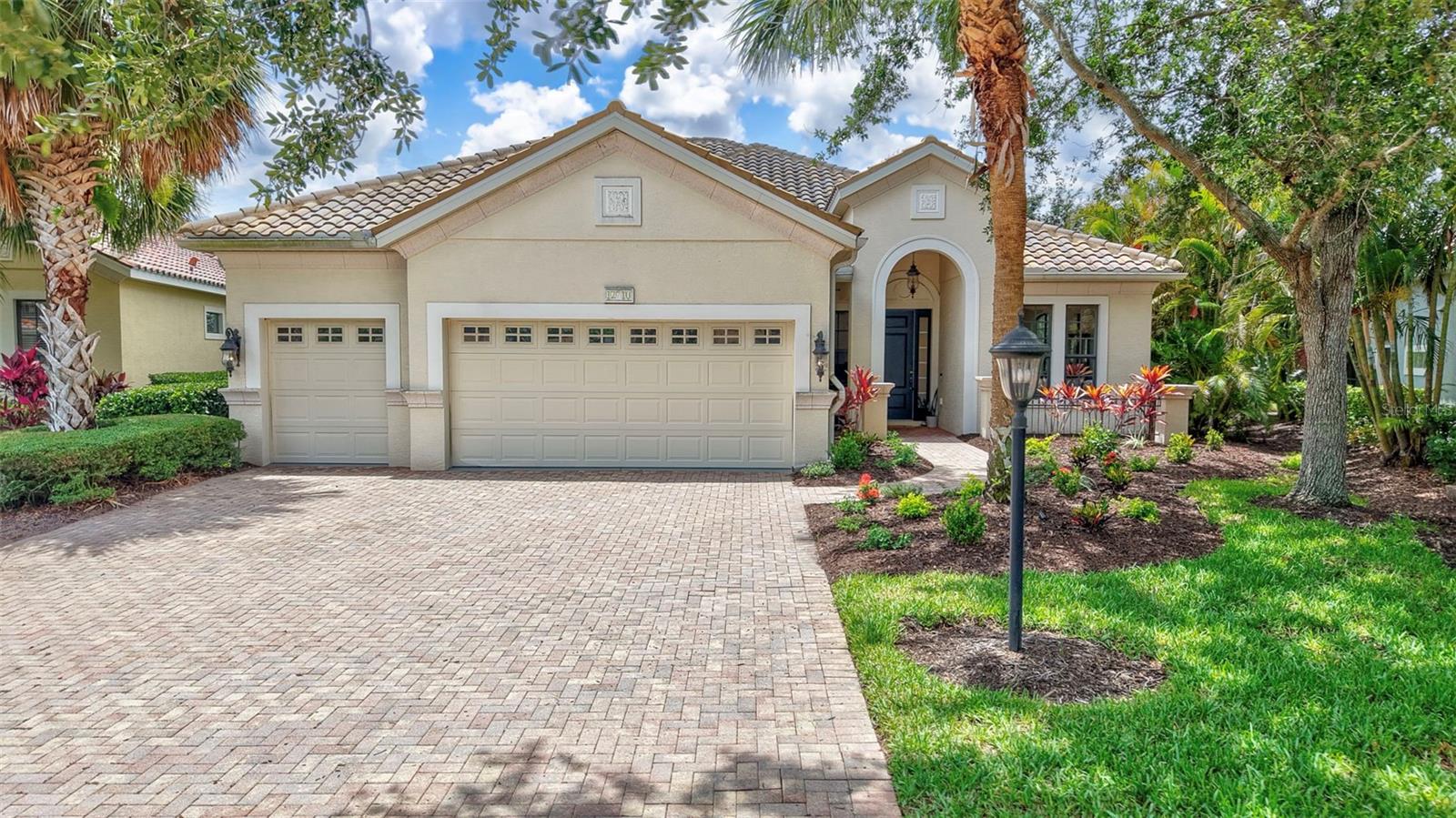 Welcome to this beautifully maintained 3,142 square foot home located in the coveted Lakewood Ranch Country Club, perfectly nestled on a peaceful cul-de-sac with breathtaking southern exposure. Enjoy panoramic views of lush preserves, serene water, local wildlife, and the picturesque 11th and 12th holes of the Kings Dunes Golf Course.
This spacious 4-bedroom, 3.5-bathroom home offers privacy and elegance throughout. Upon entering, you’ll be greeted by a grand layout, tile floors, crown molding, a neutral color palette, and a stunning view through the home to the inviting pool and natural beauty beyond.
The gourmet kitchen features granite countertops, stainless steel appliances, a gas stove, and seamlessly opens to the family room, casual dining area, and breakfast bar—perfect for both everyday living and entertaining. The luxurious primary suite includes a coffered tray ceiling, large walk-in closet, and a spa-like bathroom with garden tub, walk-in shower, and dual vanities.
Additional highlights include a private study/office, a first-floor primary suite, two additional generously sized bedrooms on the main floor, and under-stair storage. Upstairs, a private guest retreat awaits—complete with full bath, computer nook, and sweeping views.
The downstairs utility room is equipped with a sink and ample cabinetry. A long paver driveway leads to a spacious garage, plus a dedicated golf cart bay with its own overhead door.
Step outside to your professionally landscaped backyard oasis featuring an expansive paver lanai, wide-entry heated pool, spillover spa, and exterior pool bath and shower.
Enjoy the ultimate Florida lifestyle in this premier community known for its top-rated schools, scenic parks, extensive trail systems, and proximity to UTC, Sarasota airport, beaches, fine dining, and more.