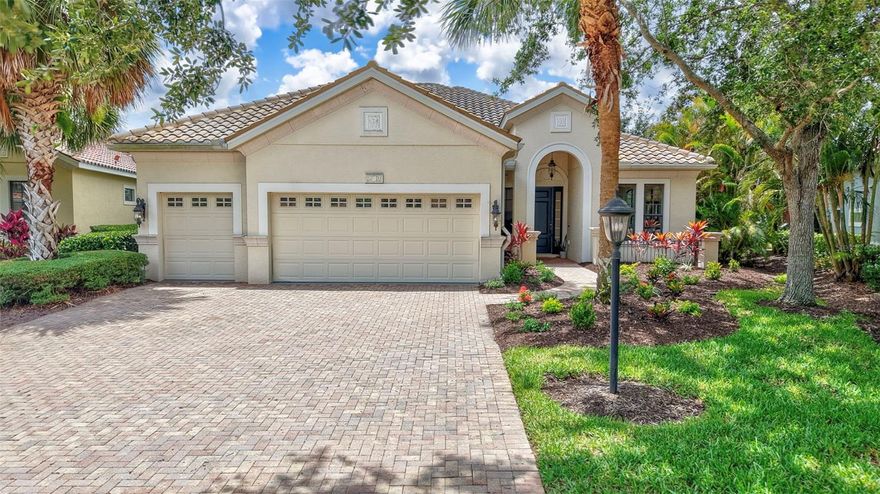 Welcome to this beautifully maintained 3,142 square foot home located in the coveted Lakewood Ranch Country Club, perfectly nestled on a peaceful cul-de-sac with breathtaking southern exposure. Enjoy panoramic views of lush preserves, serene water, local wildlife, and the picturesque 11th and 12th holes of the Kings Dunes Golf Course.
This spacious 4-bedroom, 3.5-bathroom home offers privacy and elegance throughout. Upon entering, you’ll be greeted by a grand layout, tile floors, crown molding, a neutral color palette, and a stunning view through the home to the inviting pool and natural beauty beyond.
The gourmet kitchen features granite countertops, stainless steel appliances, a gas stove, and seamlessly opens to the family room, casual dining area, and breakfast bar—perfect for both everyday living and entertaining. The luxurious primary suite includes a coffered tray ceiling, large walk-in closet, and a spa-like bathroom with garden tub, walk-in shower, and dual vanities.
Additional highlights include a private study/office, a first-floor primary suite, two additional generously sized bedrooms on the main floor, and under-stair storage. Upstairs, a private guest retreat awaits—complete with full bath, computer nook, and sweeping views.
The downstairs utility room is equipped with a sink and ample cabinetry. A long paver driveway leads to a spacious garage, plus a dedicated golf cart bay with its own overhead door.
Step outside to your professionally landscaped backyard oasis featuring an expansive paver lanai, wide-entry heated pool, spillover spa, and exterior pool bath and shower.
Enjoy the ultimate Florida lifestyle in this premier community known for its top-rated schools, scenic parks, extensive trail systems, and proximity to UTC, Sarasota airport, beaches, fine dining, and more. POSSIBLE SELLER CREDITS AVAILABLE TOWARDS UPDATES, RATE BUY DOWN AND/OR CLOSING COSTS.