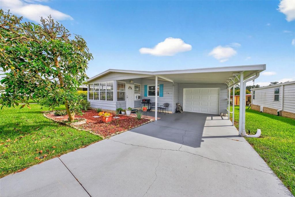 Photo of 710 Carriage Lane, Leesburg, FL 34748 (MLS # G5103192)