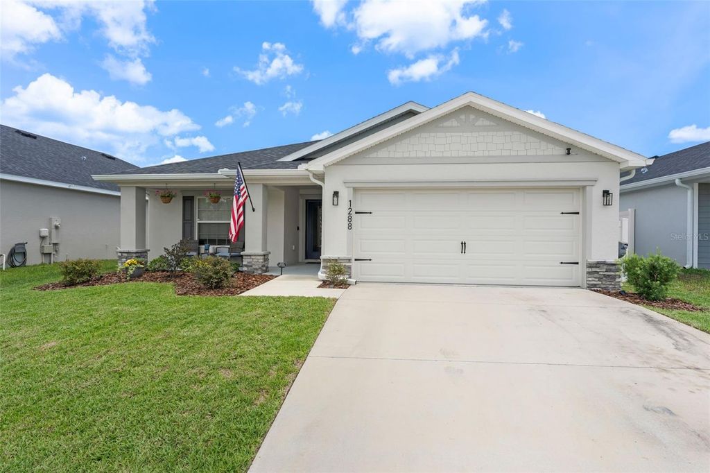 Photo of 1288 Mountain Flower Lane, Davenport, FL 33837 (MLS # O6411570)