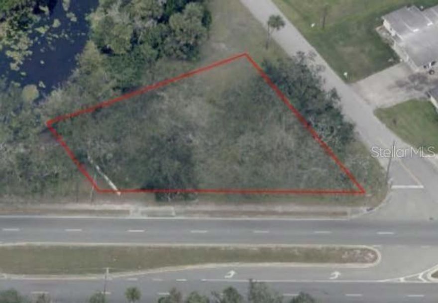 High visibility prime location in New Smyrna Beach.  Over 1/3 acre of vacant land, with 172 linear feet on north side of SR 44 and 138 linear feet on Ellison Avenue.  Two existing curb cuts, one on SR 44 and the other on Ellison Avenue.   Utilities available.