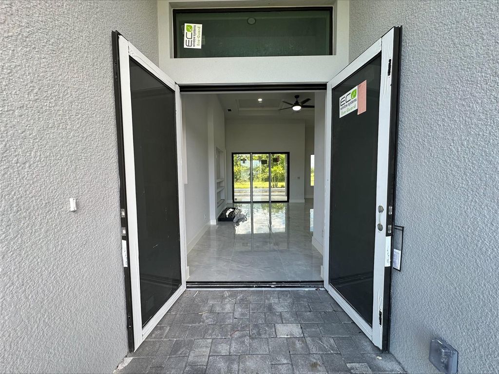 Photo of 419 NW 4th Terrace, Cape Coral, FL 33993 (MLS # A4666895)