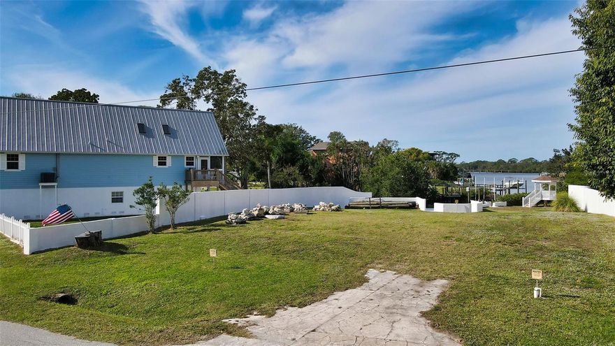 Build your waterfront dream home on this oversized 17,000-square-foot cleared, filled and ready homesite with spectacular long sunset views of Shakett Creek Bay and Legacy Trail Bicycle Bridge. A concrete seawall in place on both sides of the property, with a new 10,000-pound boat lift. Electric and water meters are at the property. The lot is a 15-minute boat ride to the gulf with a bridge clearance of 12 to 13 feet, allowing for larger boats. The bike trail, highly rated Pine View School, new Sarasota Memorial Hospital, Nokomis Beach and downtown Venice and shopping are all a short distance. Don’t miss this reasonably priced waterfront property. Owner financing is available.