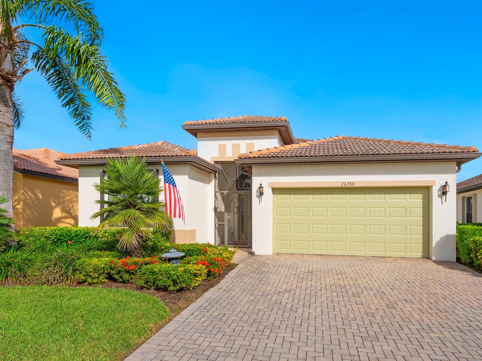 Enjoy lake views and resort-style living in Venetian Falls, Venice’s premier 55+ gated community—just minutes from Gulf beaches, shopping, dining, and the charming historic district! This spacious 3-bedroom Milan model offers a thoughtfully designed open floor plan with separate living, dining, and family rooms, blending elegance with everyday comfort. Enter through the screened front entry into a welcoming foyer featuring a leaded-glass front door with sidelight and transom window. The home showcases floating luxury vinyl flooring in the main living areas. The kitchen features one-level quartz countertops, a stylish mosaic backsplash, solid-wood cabinets with trim, dimmable under-cabinet lighting, stainless-steel appliances including a range with convection and air fryer, and a walk-in pantry. The adjacent bay-shaped sitting room with three windows, captures peaceful lake views. Enjoy outdoor living on the spacious lanai, perfect for dining, grilling, or lounging. For peace of mind, the home includes accordion storm shutters, remote-controlled roll-down storm screens, whole-house water filtration and softener system, and surge protection. The two-car garage features a durable epoxy floor, utility sink, and an extra refrigerator. Wonderful curb appeal! Pavers enhance the driveway, walkway, and lanai. Venetian Falls offers resort-style amenities including a clubhouse with heated lap pool and spa, resistance-walking pool, fitness center, billiard room, bocce courts, full-time activities director, on-site management, and so much more! Lawn care, irrigation, basic cable, and internet are all covered by the reasonable HOA fee. Don’t miss this beautifully maintained home with lake views and luxury upgrades in one of Venice’s most desirable communities!