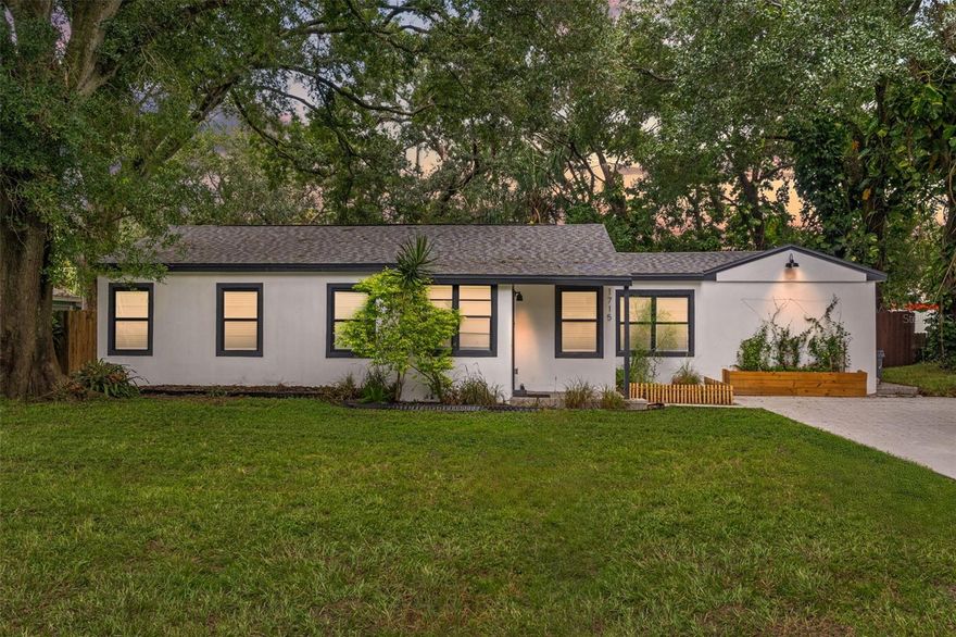Experience a refined mid-century modern retreat in the heart of charming Wellswood. This meticulously updated home offers an unbeatable layout, engineered to balance private quarters with expansive, open-concept social zones that feel both substantial and inviting. Positioned high and dry in Flood Zone X, the home provides a total peace of mind to match its sophisticated aesthetic.
The interior makes a strong impression with crisp, bright paint and custom finish work that adds a layer of organic texture to the clean modern lines. A high-caliber chef’s kitchen serves as the home’s center, featuring all stainless appliances, sleek shaker cabinetry, and substantial counter seating built for serious entertaining. The primary suite is a true sanctuary, boasting an oversized walk-in closet and a master bathroom centered around a beautiful shower with a frameless glass door. Both bathrooms are outfitted with smart mirrors and custom tile work and luxury finishes.
Outside, the primary bedroom opens directly onto a private patio finished with new pavers, overlooking nearly a quarter-acre of fenced-in privacy. The deep backyard provides a massive canvas with more than enough room to build a custom pool and outdoor lounge. Located with fast access to the urban hubs of Midtown, Seminole Heights, and the Downtown Riverwalk, this turn-key property is reinforced by a home warranty and a transferable termite warranty for worry-free living. Tours Available.