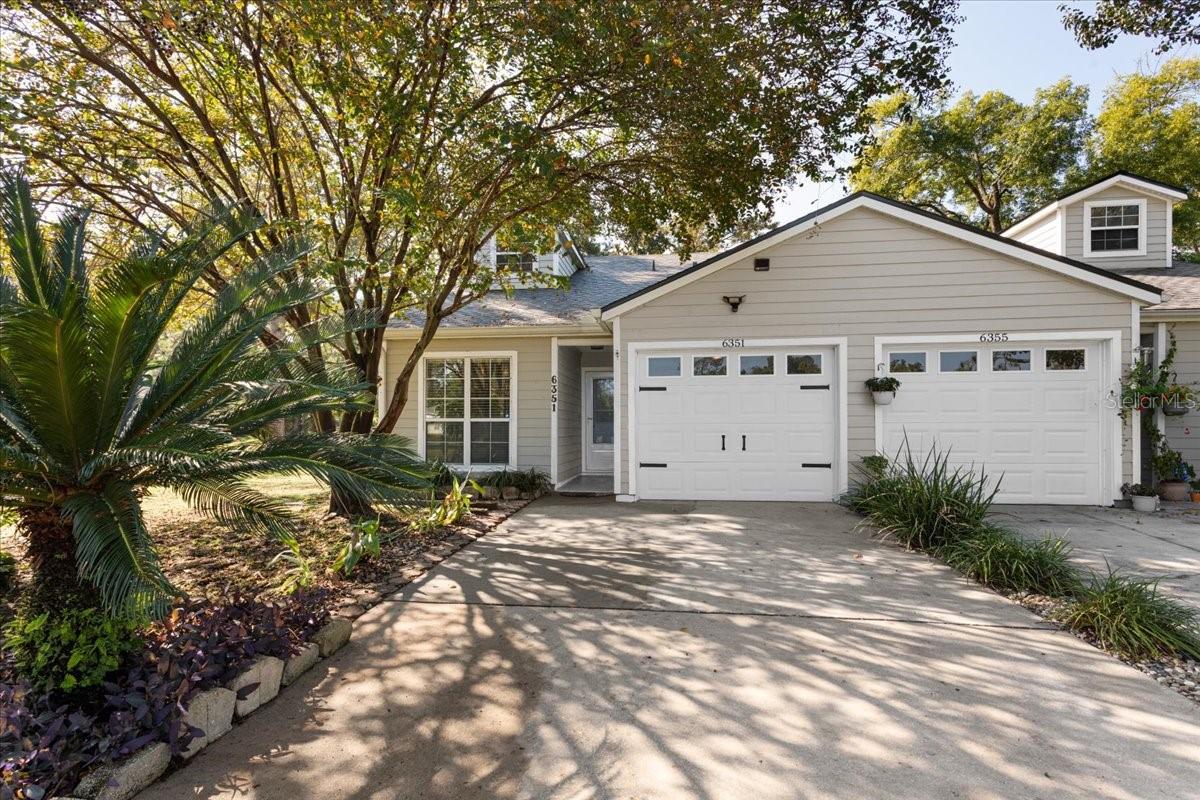 This move-in ready home has been thoughtfully updated to provide both comfort and peace of mind, featuring a 2023 roof with Cat 3 hurricane certification, Cat 3 Pella bathroom windows added in 2020, an upgraded AC system from 2020 with semi-annual maintenance, a 2021 hot water heater, fresh exterior paint in 2022, and updated interior paint in 2025. Inside, the master bath offers a spa-like retreat, the kitchen includes a new sink, faucet, and 2025 garbage disposal, and the garage floor has been finished with epoxy this year, all supported by preventative pest control and consistent professional care. The screened porch extends your living space outdoors, where you’ll enjoy a front-row seat to the 3rd hole of the golf course and the unique entertainment of glow-ball tournaments that bring fun and energy right to your backyard.