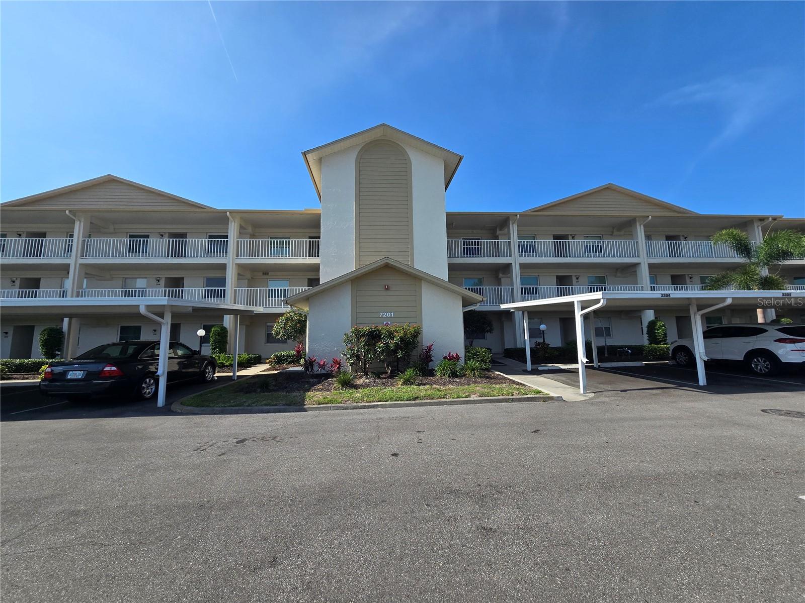 This condo is on the desired third floor, very close to the elevator and private. The inviting layout is conducive for entertaining. The high ceilings give a you a spacious sensation. Windows have been installed in the lanai and is perfect for year round use, quiet time and relaxing The impact windows and front door were installed in 2023 and are double Pane, insulated windows with vinyl frames. Also, the shades are upgraded. The HVAC system was installed in 2022 and the kitchen appliances are new. This condominium is ready for your arrival and belongings. It's located in a very active 55+ community with many amenities for your enjoyment and social life. Country Village has been a popular place to live with most residents staying for many years. There is a comforting sense of happiness and an abundant list of activities if you choose to participate. The layout hosts an entrance hallway with split bedrooms on either side. The dining/living area is open. The eat in kitchen is large with room for a table that seats up to four and the sliding glass doors lead to the enclosed lanai. The laundry closet and washer/dryer is off the lanai for convenience. There is an assigned carport space and guest parking close to the unit and is within walking distance of the clubhouse and pool. Enjoy the large heated pool, spa, pool tables, exercise equipment, library, bingo, shuffleboard, outdoor grilling area, on site management, library, etc. Owners are allowed one small pet no more than 30 pounds. Country Village offers a full calendar of activities year round. All amenities are within a few minutes drive. This includes houses of worship, restaurants, hospitals, airports, major highways, entertainment, many stores, etc. Major airports are within approximately an hour drive, also professional sports, world class rowing, malls, popular beaches, etc. This includes Anna Marie Island, Siesta Beach, Lido Beach, St Armand's and Lakewood Ranch. Disney, Orlando, Sanibel Island are all an approximate ninety minute drive. If you want to relax and enjoy the beautiful sunsets, you are a short ten minute drive from the Gulf of Mexico Beaches. If you want to fish and/or go boating, water access is a few minutes drive. Kayaking and Jet skiing is also available. This unit is a must see if you are shopping for a bargain in West Bradenton close to recreational activities and all amenities. Come see what paradise has to offer. Schedule a preview of this unit now. It is doubtful it will last if you wait.