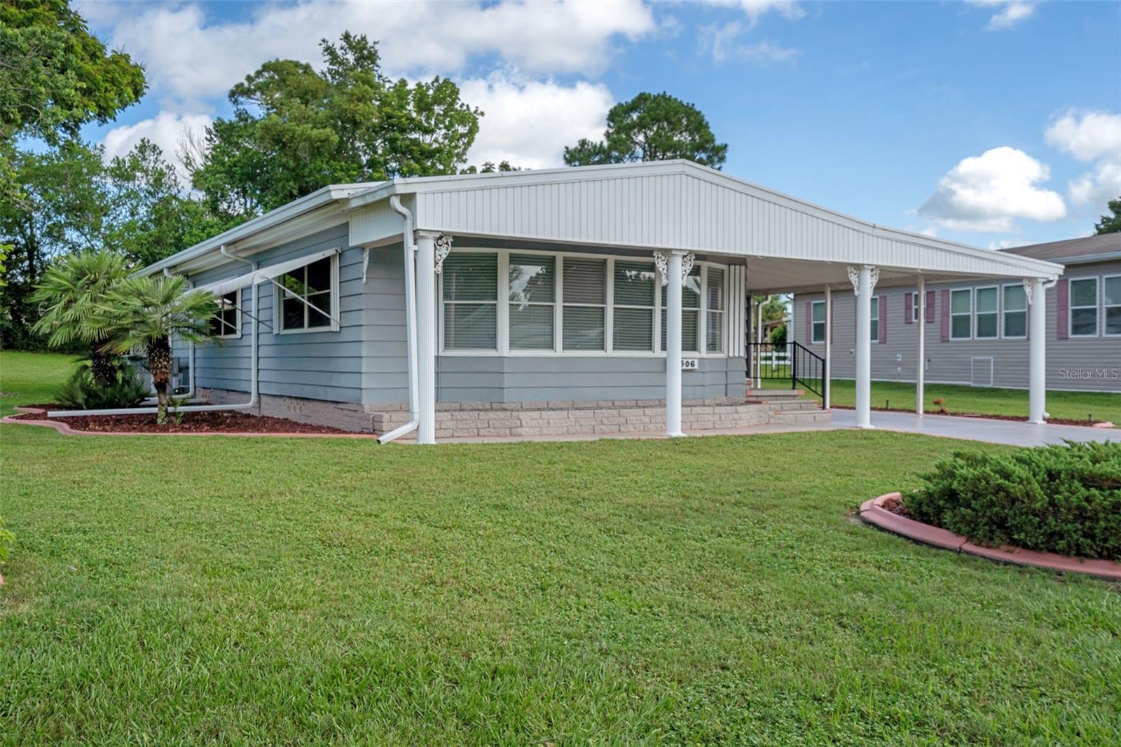 Affordable Florida living for your next season in life! Now’s the time! Brookridge is 55+ Community where you own your own land with low HOA fees. The community is gated 24/7 so if you travel or want to live a snowbird life you will have peace of mind. This 2 Bedroom 2 Bathroom is a very spacious 1,430 sq ft with a nice kitchen that boasts lots of Counters, Cabinets, and a Pantry! Large Open Living room with windows galore for natural lighting! The kitchen even has a skylight. Newer Flooring, interior paint and vapor barrier. Formal dining area for entertaining or hosting. Large screened porch provides additional room and shade for gathering and enjoying the best of Florida living. With a carport and a small, separate garage for your golf cart. The primary bedroom has a spacious en suite, two closets, dual sinks, makeup vanity and tub/ shower combo with separate toilet closet. Large ? acre yard. Carpet in bedrooms only. AC 2016. Windows replaced 2018. Metal Roof with screws sealed 2025. 3 steps to exterior doors. Water heater is older but is satisfactory. Seller will consider replacing water heater with accepted offer. The laundry room is located in the utility room just off the screened porch. Washer and Dryer, refrigerator, range, dishwasher and microwave convey. The Brookridge Community is Gated 24/7 and is brimming with activity boasting a 72-par Championship Golf Course & Pro Shop, Heated Swimming Pool, Tennis/Pickleball and Shuffleboard Courts, Horseshoes, Bocci Ball Court, Club House, Bingo, Crafts, Shows, and over 100 social Groups. On-site RV and boat storage. There is a real sense of community where you will meet new friends. Just minutes away from the Suncoast Parkway, which provides a quick and direct route to Tampa, St. Pete, Sporting Venues, Cultural Arts, and world-famous Beaches as well as the Tampa International Airport. Hwy 50 is a direct route to Orlando. Enjoy nearby shopping, dining, and entertainment options. Don't miss this rare opportunity to own a piece of Florida paradise in Brookridge. Schedule your private showing today.