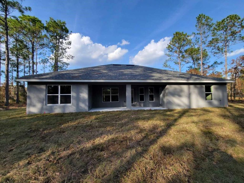 Photo of 12384 SW 96th Lane, Dunnellon, FL 34432 (MLS # OM703702)