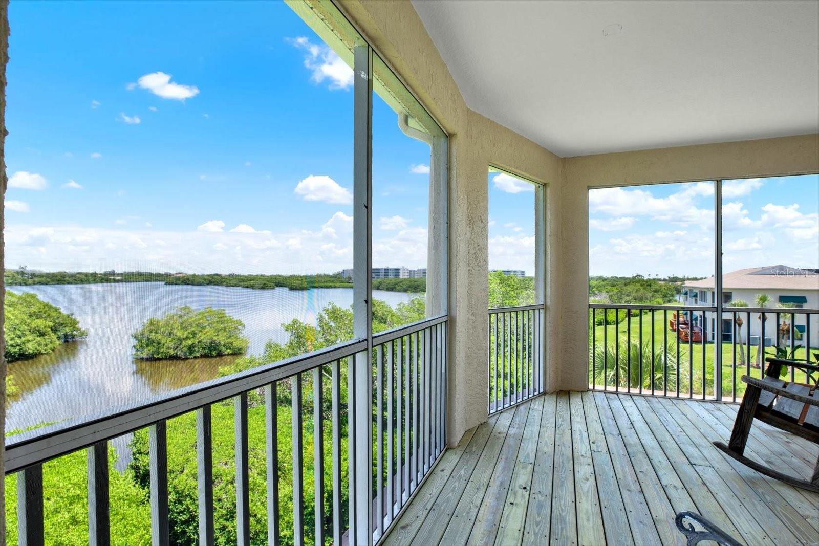 STUNNING 3BR/3BA TOWNHOUSE WITH OVERSIZED GARAGE & PRIVATE ELEVATOR IN SEMINOLE’S SHORES OF LONG BAYOU! Don’t miss this rare opportunity to own one of only 4 luxury townhomes in this sought-after gated, pet-friendly, non-age restricted community! Beautifully maintained, this spacious unit offers GORGEOUS WATERWAY VIEWS from screened balconies on both the 2nd and 3rd floors. The main level features a light-filled great room with crown molding and screened porch access with fabulous WATER VIEWS, formal dining room, full bath, guest bedroom (currently used as a family room) and laundry room. The kitchen impresses with granite counters, stainless steel appliances, abundant wood cabinetry, and breakfast bar. Upstairs, the grand primary suite boasts soaring ceilings, a private sitting area, French doors to a screened patio, 2 spacious closets, and a luxurious en-suite bath with soaking tub and walk-in shower. A 2nd upper-level bedroom and full hall bath provide perfect guest or office space. Additional highlights include a PRIVATE IN-UNIT ELEVATOR, laundry room, generous storage, and OVERSIZED GARAGE with space for 3+ cars, recreational gear, and more. Bonus finished space on the ground level opens to a covered patio—ideal for a rec room or home gym. Updates include ROOF (2017), Water Heater (2020), NEW IMPACT WINDOWS AND DOORS (2021), 2 HVAC UNITS (2021/2022), and Water Softener. Enjoy the Florida lifestyle with community amenities including two pools (one heated), spa, fitness center, clubhouse, nature trails, and kayak/canoe launch. All just minutes from gorgeous beaches, the Pinellas Trail, Lake Seminole Park, and Seminole City Center offering shopping, dining and entertainment. Schedule your private tour today!