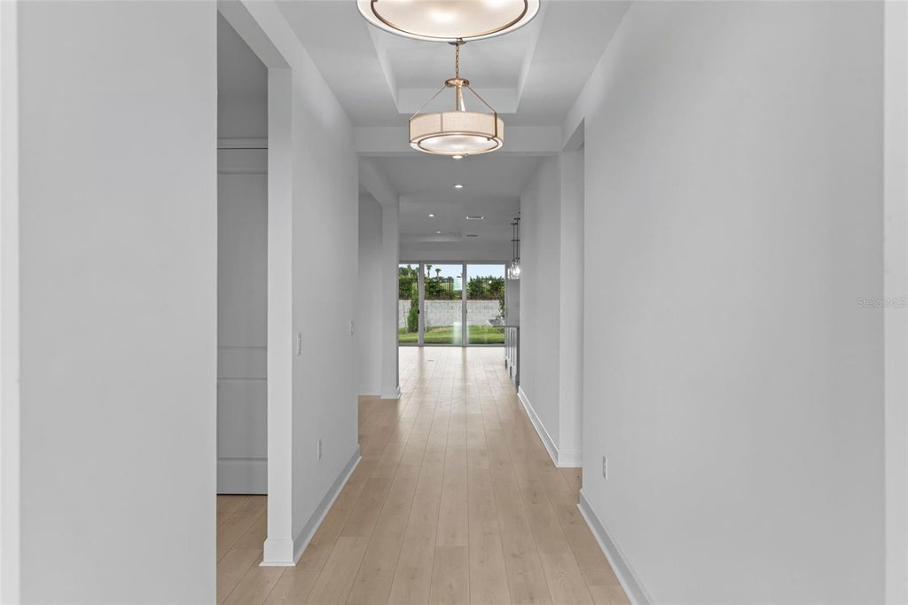 Photo of 557 Hammock Oaks Boulevard, Lady Lake, FL 32159 (MLS # W7890757)