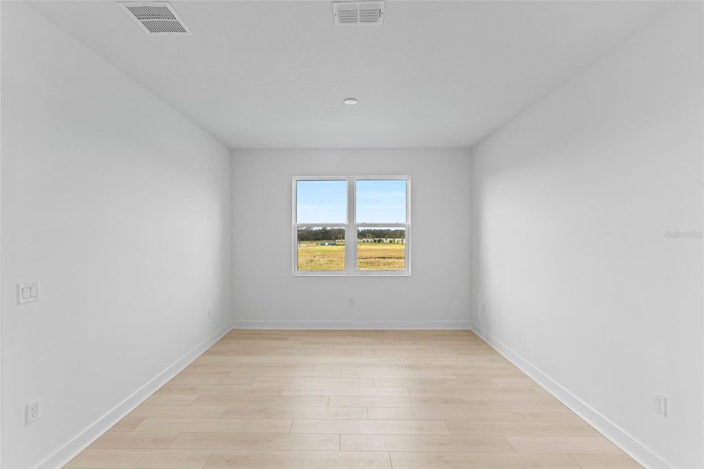 Photo of 557 Hammock Oaks Boulevard, Lady Lake, FL 32159 (MLS # W7890757)