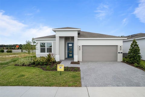 Photo of 557 Hammock Oaks Boulevard, Lady Lake, FL 32159 (MLS # W7890757)
