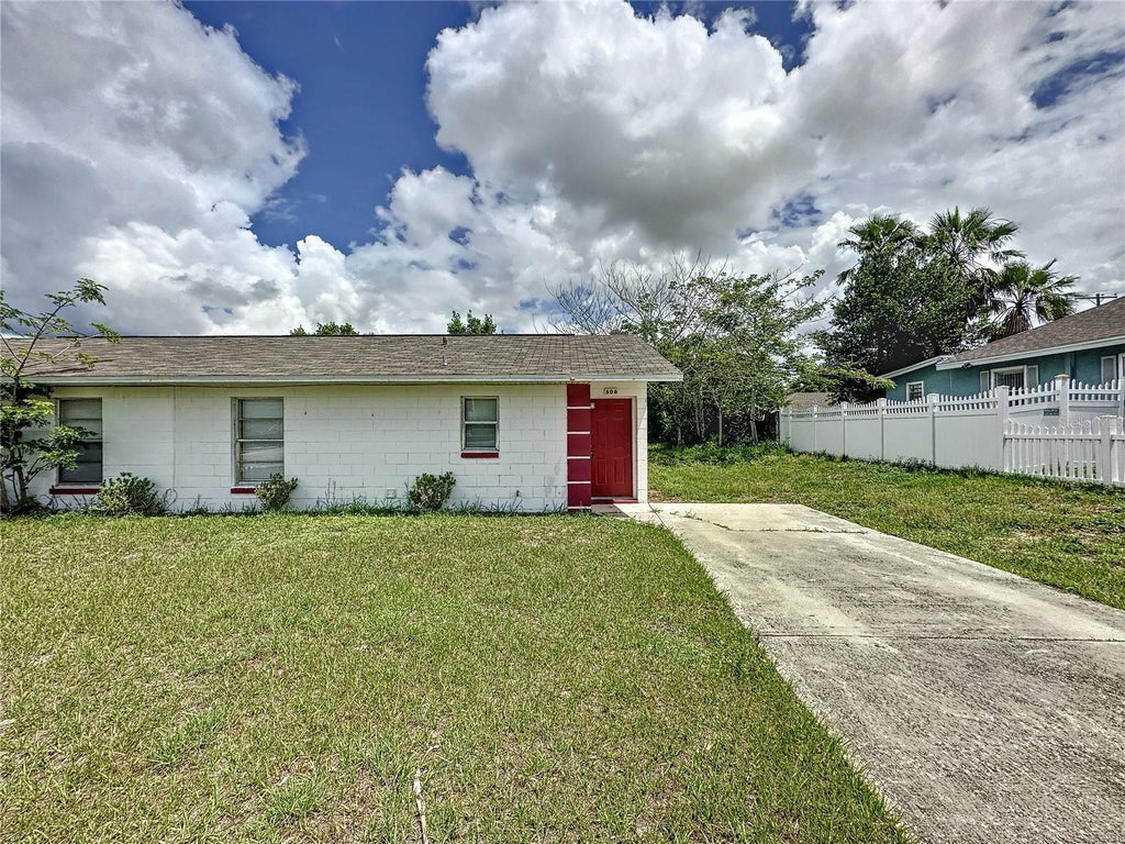 Photo of 606 Claude Holmes Sr Avenue, Haines City, FL 33844 (MLS # S5156837)