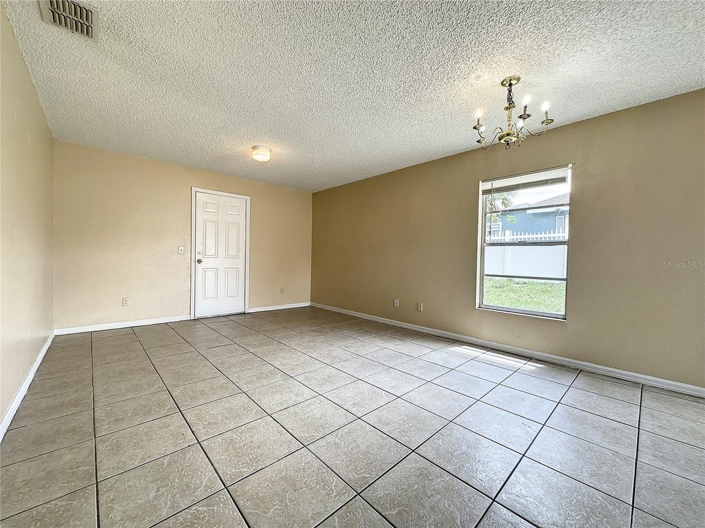 Photo of 606 Claude Holmes Sr Avenue, Haines City, FL 33844 (MLS # S5156837)